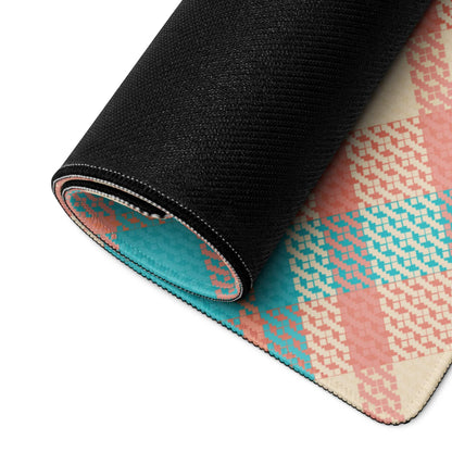 Rolled-up gaming mouse pad backside with black textured backing and vibrant teal peach plaid pattern