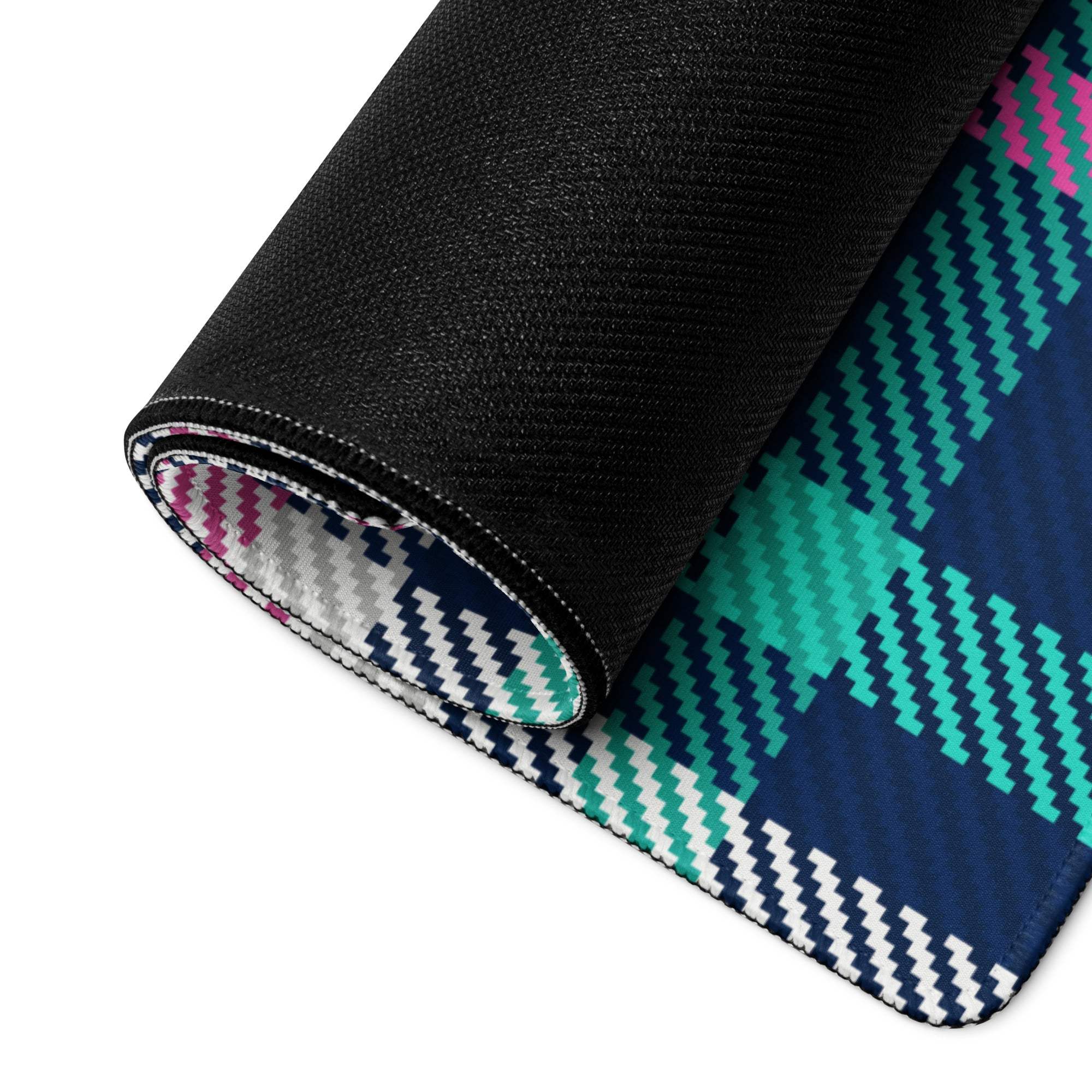 Rolled-up vibrant pink navy teal plaid gaming mouse pad with non-slip base