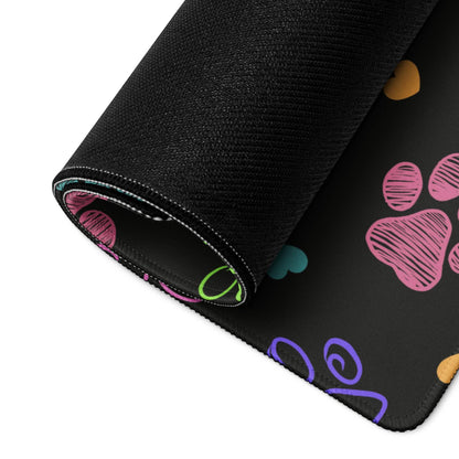 Large colorful paw print gaming mouse pad with non-slip base, black textured surface
