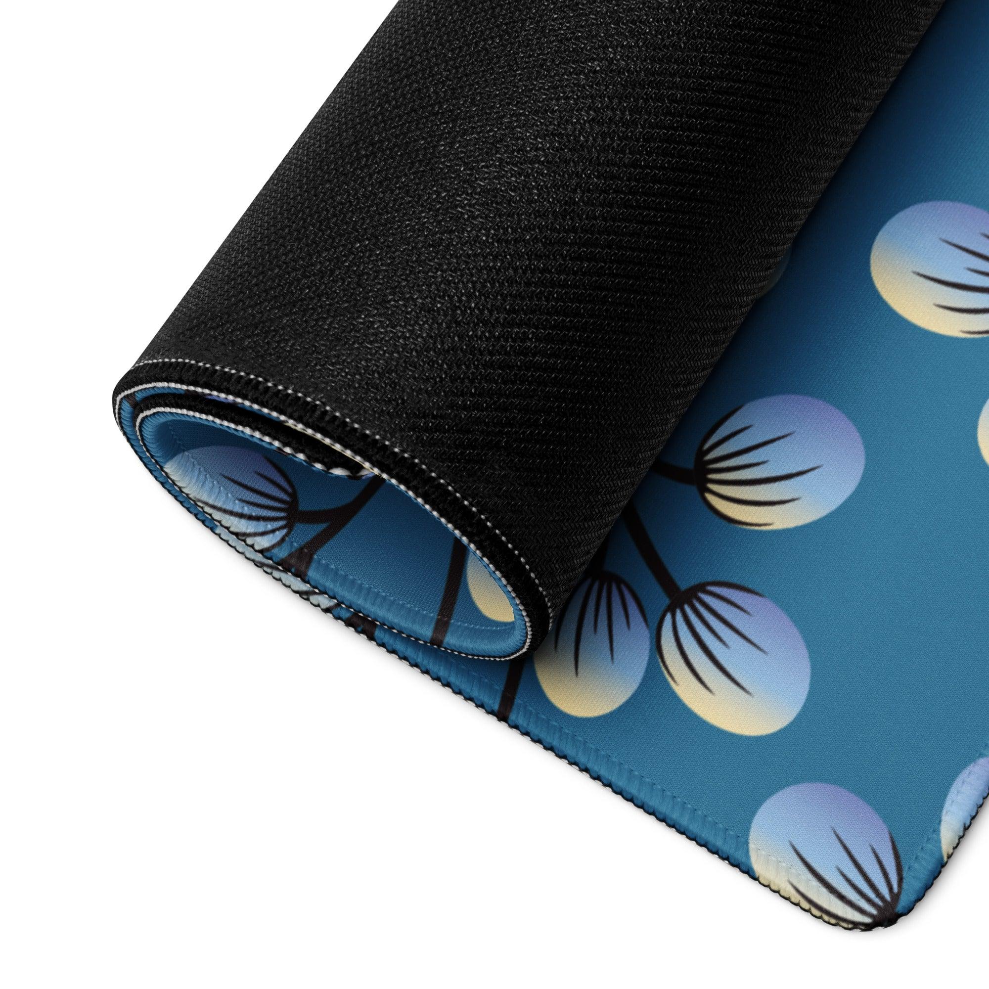 Blue gaming mouse pad with dandelion pattern, textured black underside