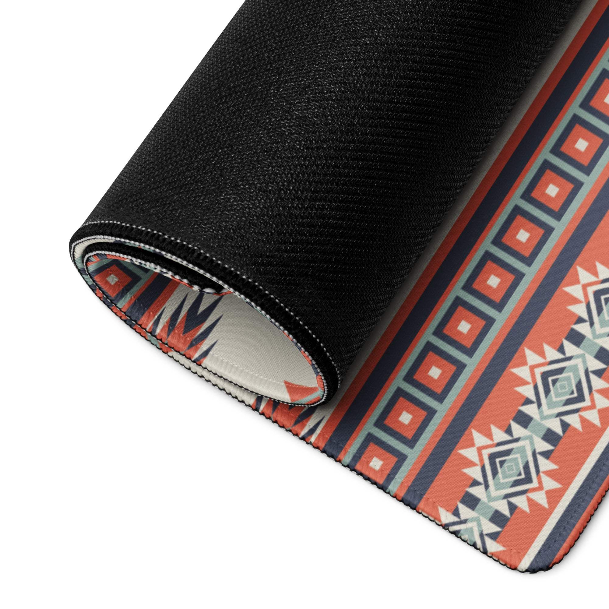 Rolled-up Aztec tribal geometric mouse pad in cream red teal with non-slip backing