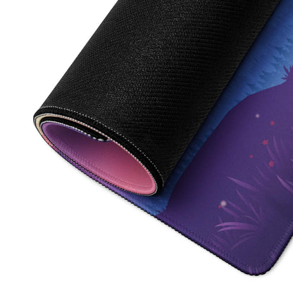 Rolled-up Dreamy Mountain gaming mouse pad with purple-blue grassy edge