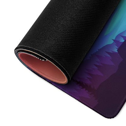 Rolled aurora borealis gaming mousepad with silhouetted trees, non-slip backing