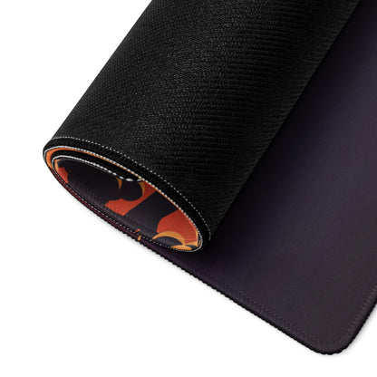 Black textured gaming mousepad with rolled edge revealing orange black flame pattern