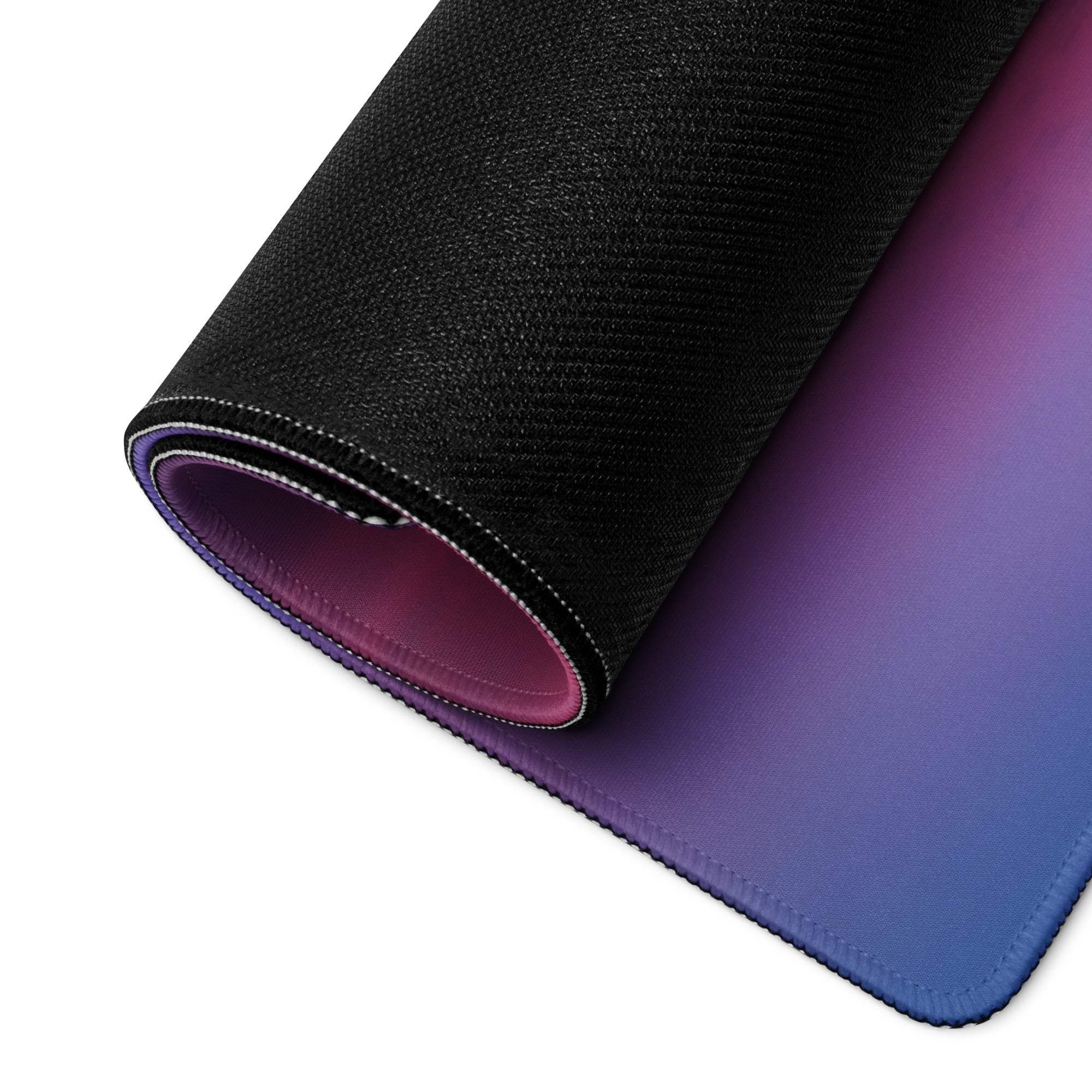 Sleek rolled-up Pastel Sunset large gaming mouse pad with purple-to-blue gradient