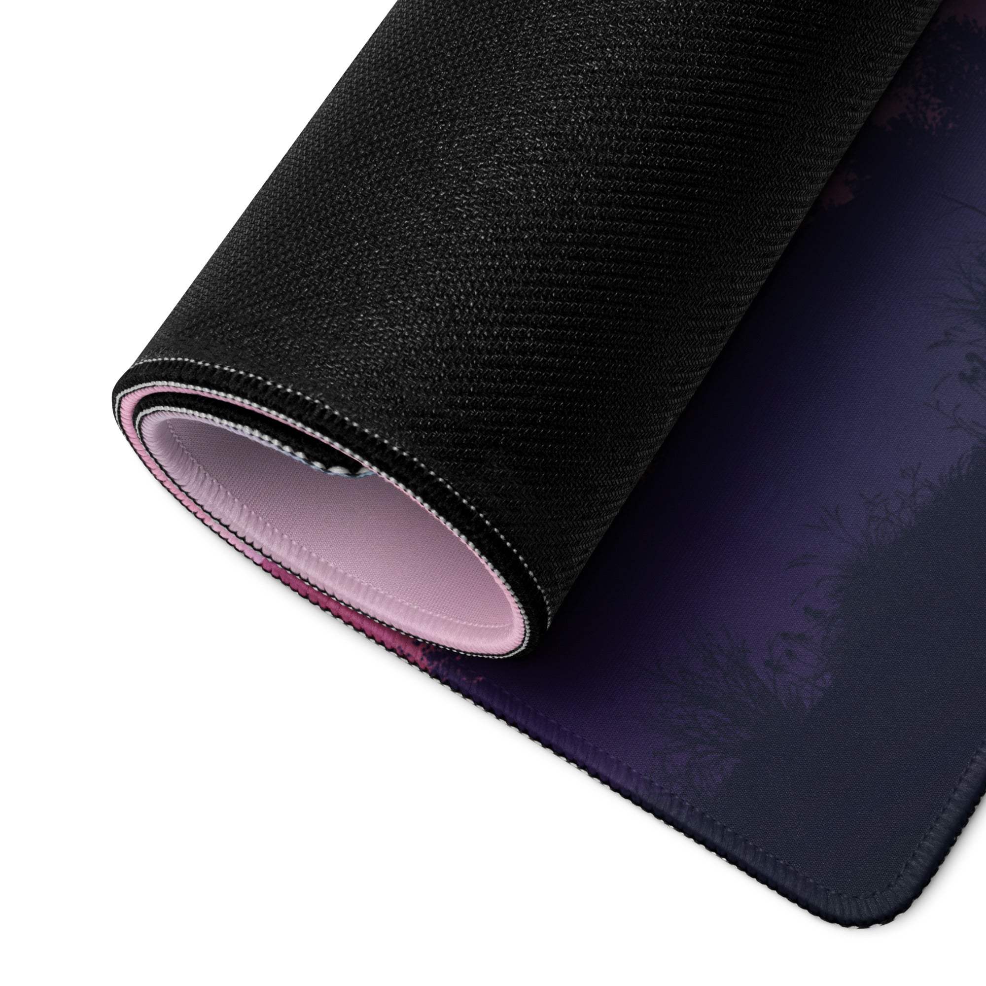 Rolled pastel pink purple sunset mountain gaming mousepad showing pink lining