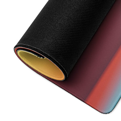 Vibrant gradient large gaming mouse pad with black texture, red to blue fade, yellow lining, stitched edges, non-slip base