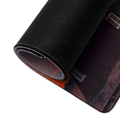Black textured gaming mousepad with rolled edge, dark house in vibrant sunset sky