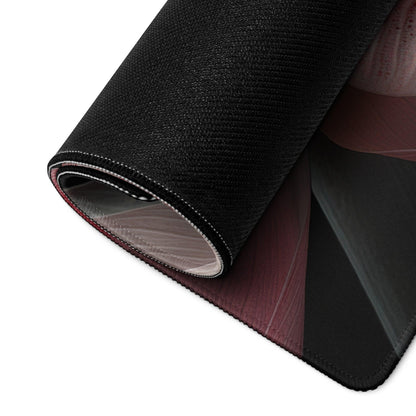 Black textured gaming mousepad with rolled maroon edge and non-slip backing