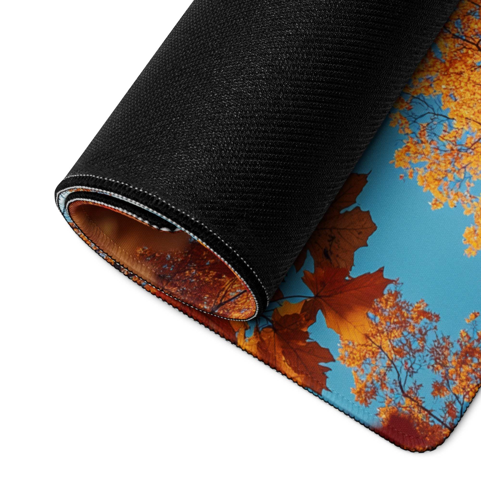 Rolled Autumn Leaves Frame Over Sky Blue gaming mouse pad with vibrant maple leaves
