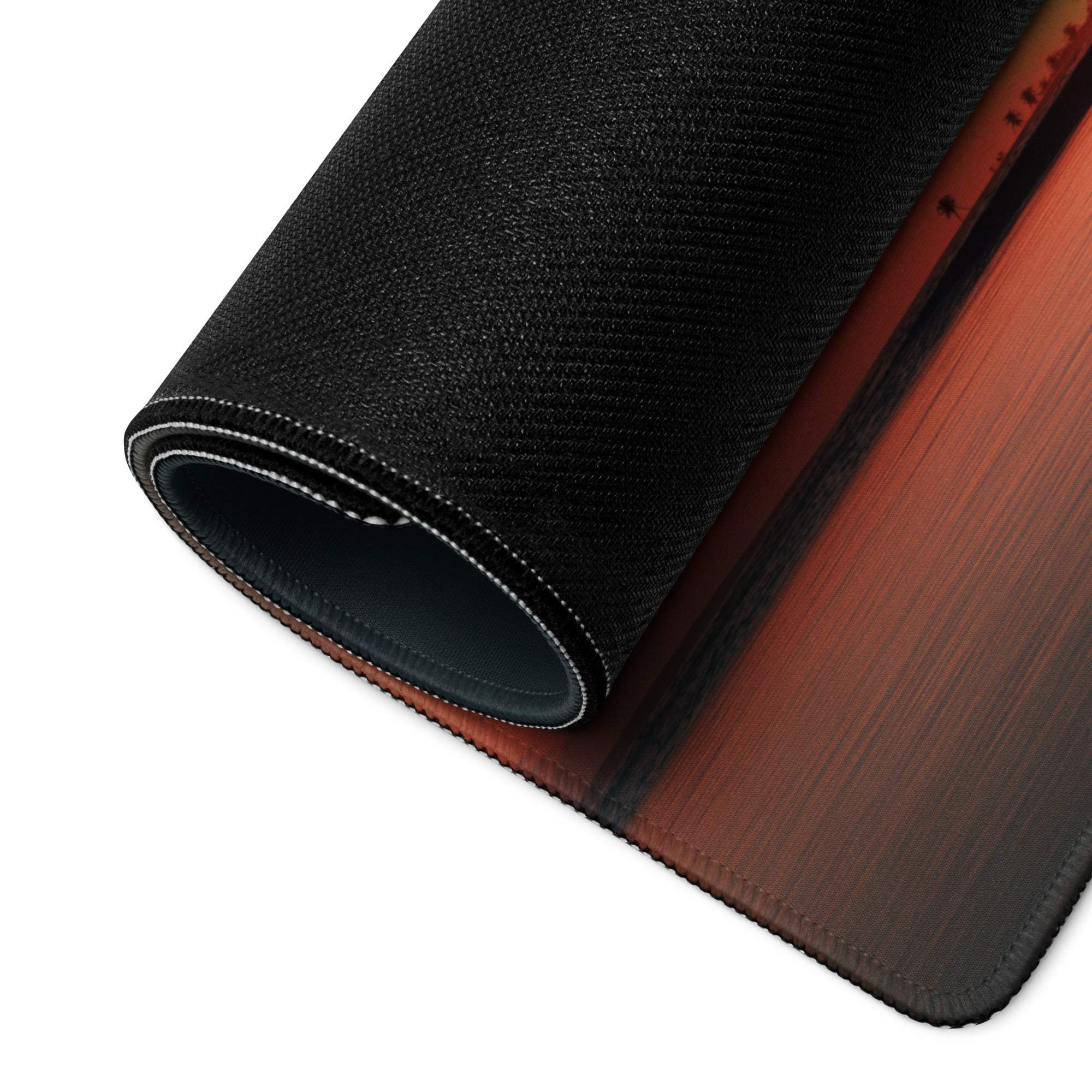 Black textured mousepad with orange-to-brown gradient and stitched edges