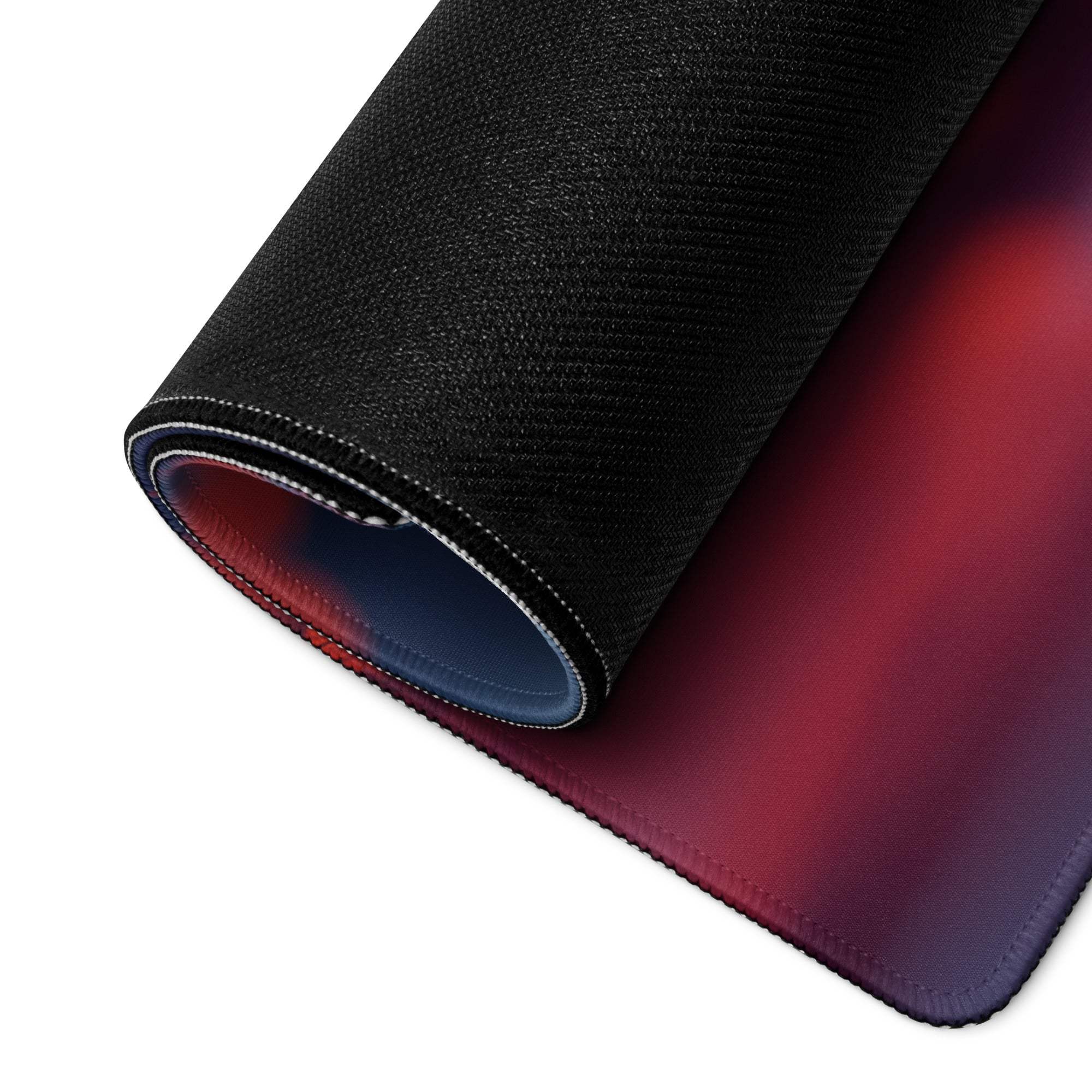 Black textured gaming mousepad with red-purple gradient, stitched edges