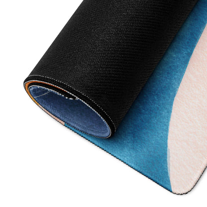 Rolled-up Vibrant Abstract Waves mouse pad with blue-pink gradient and black backing