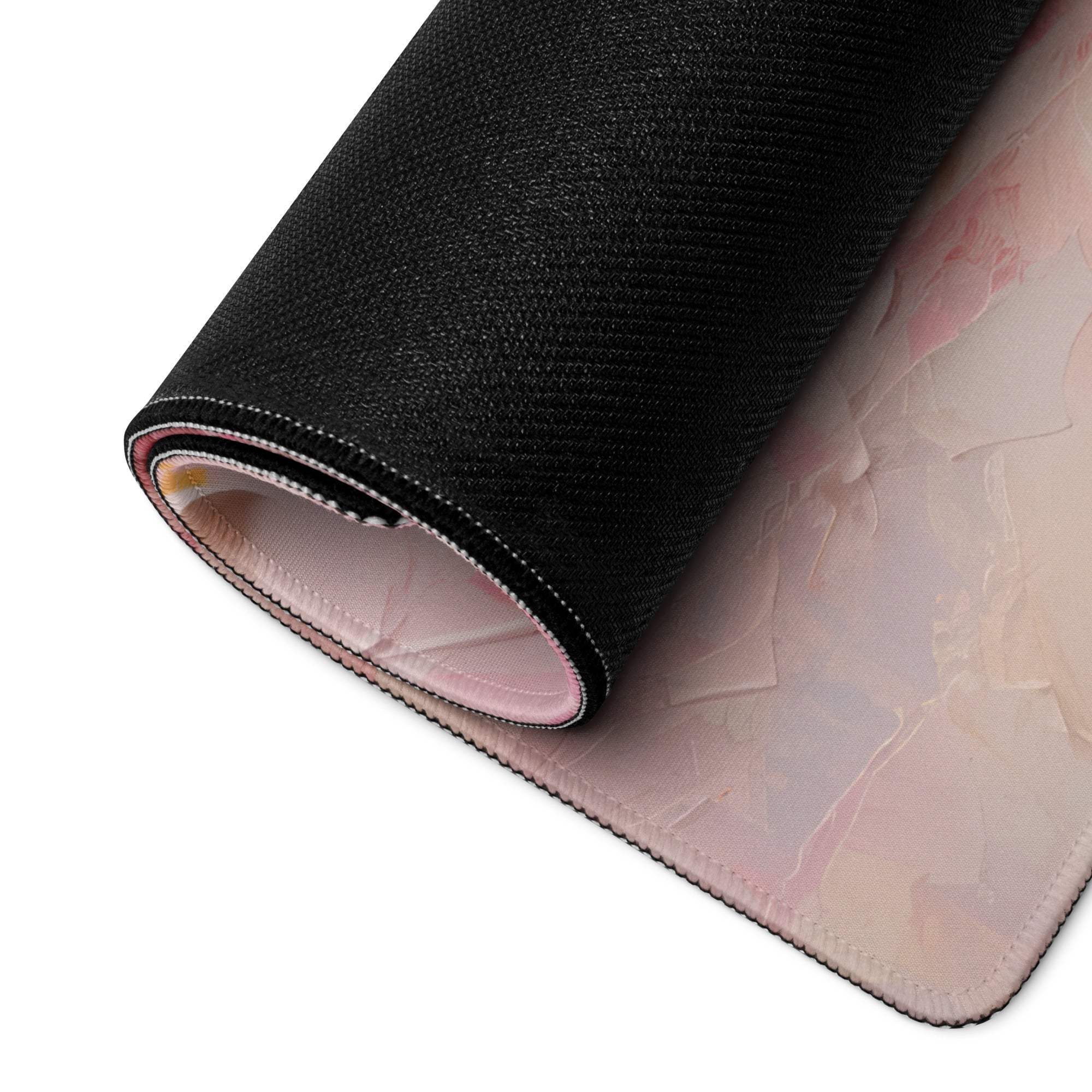 Rolled-up elegant floral pink gaming mouse pad with textured surface
