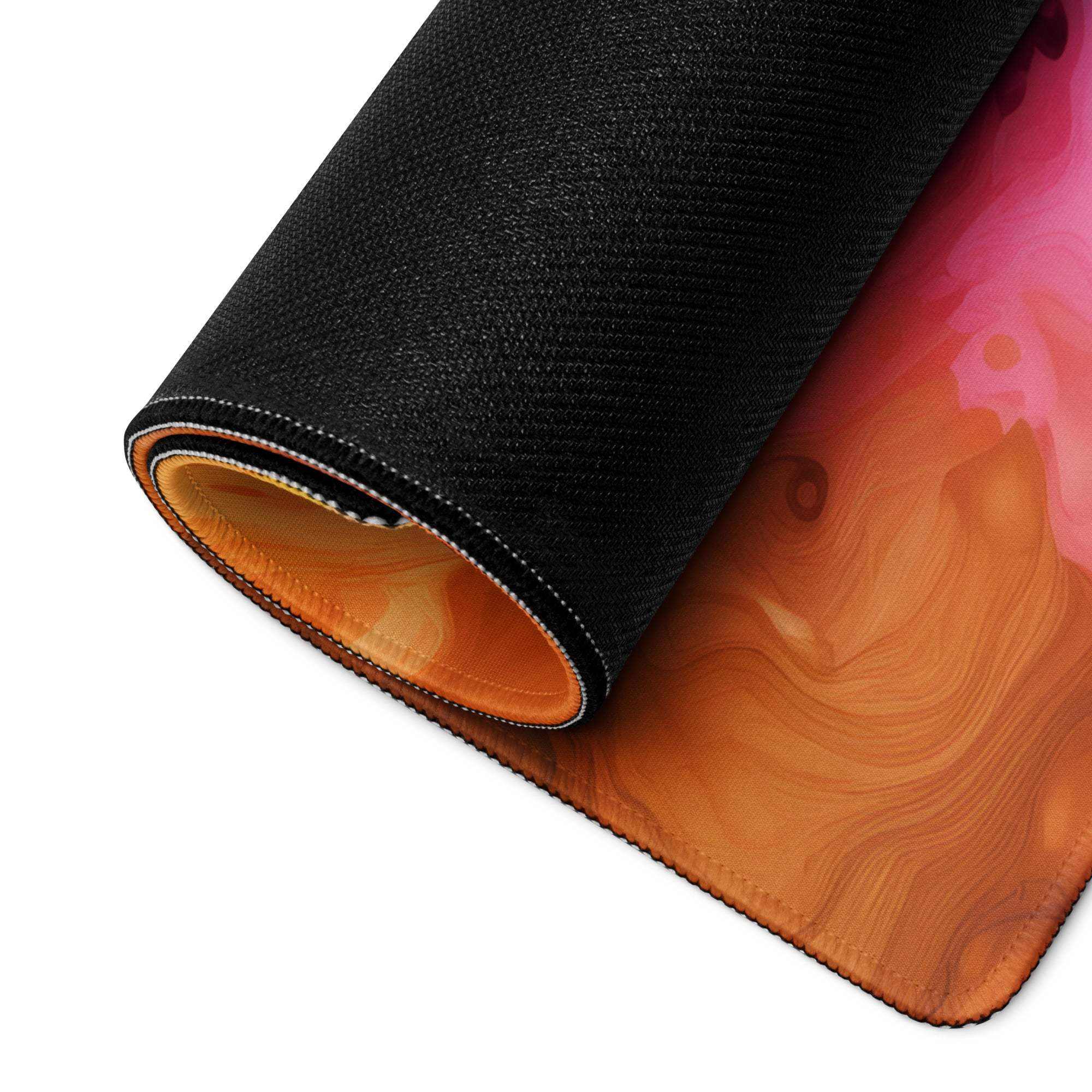 Vibrant multicolor abstract burst gaming mouse pad rolled up with non-slip base