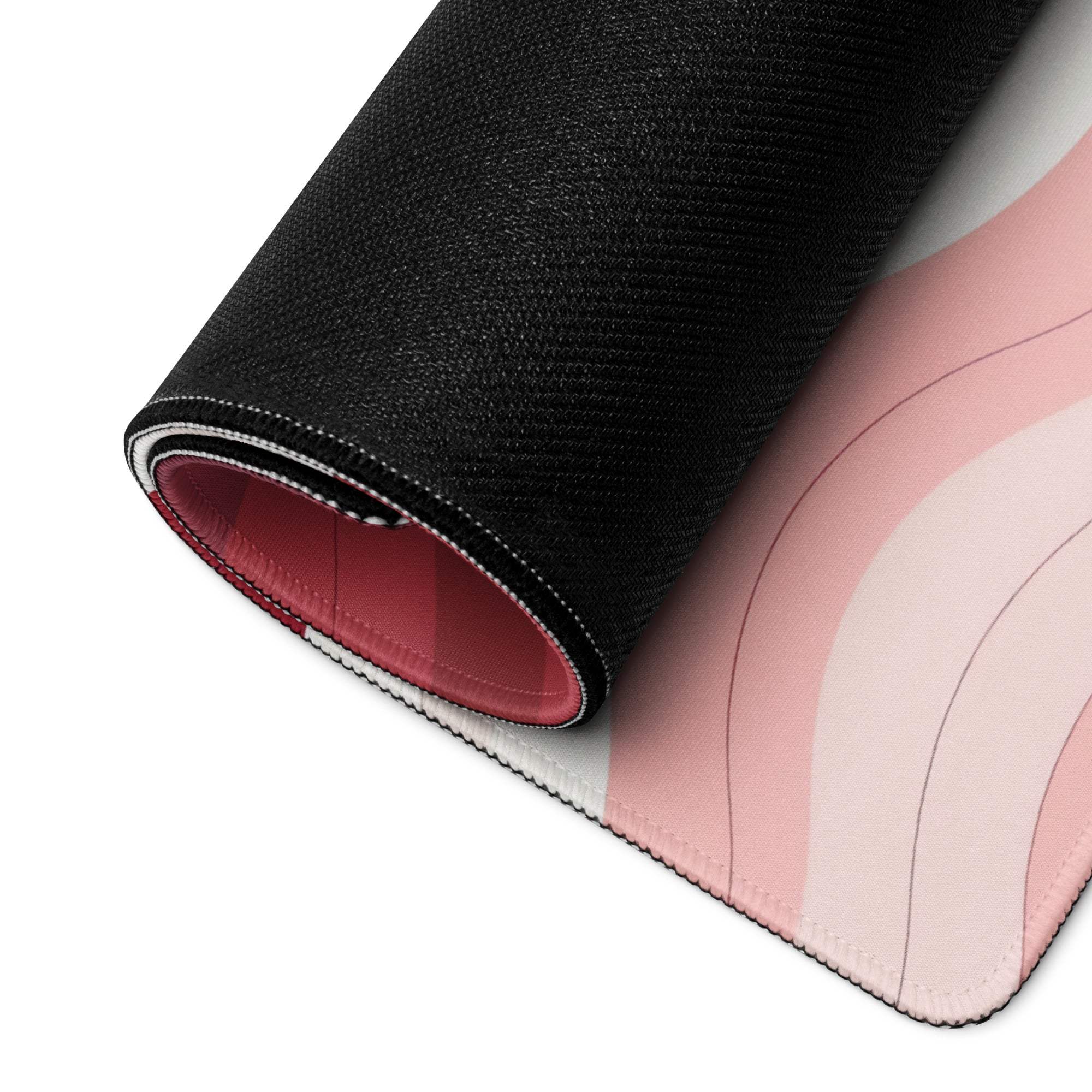 Rolled-up Vibrant Crimson Rose Wave gaming mouse pad with non-slip base