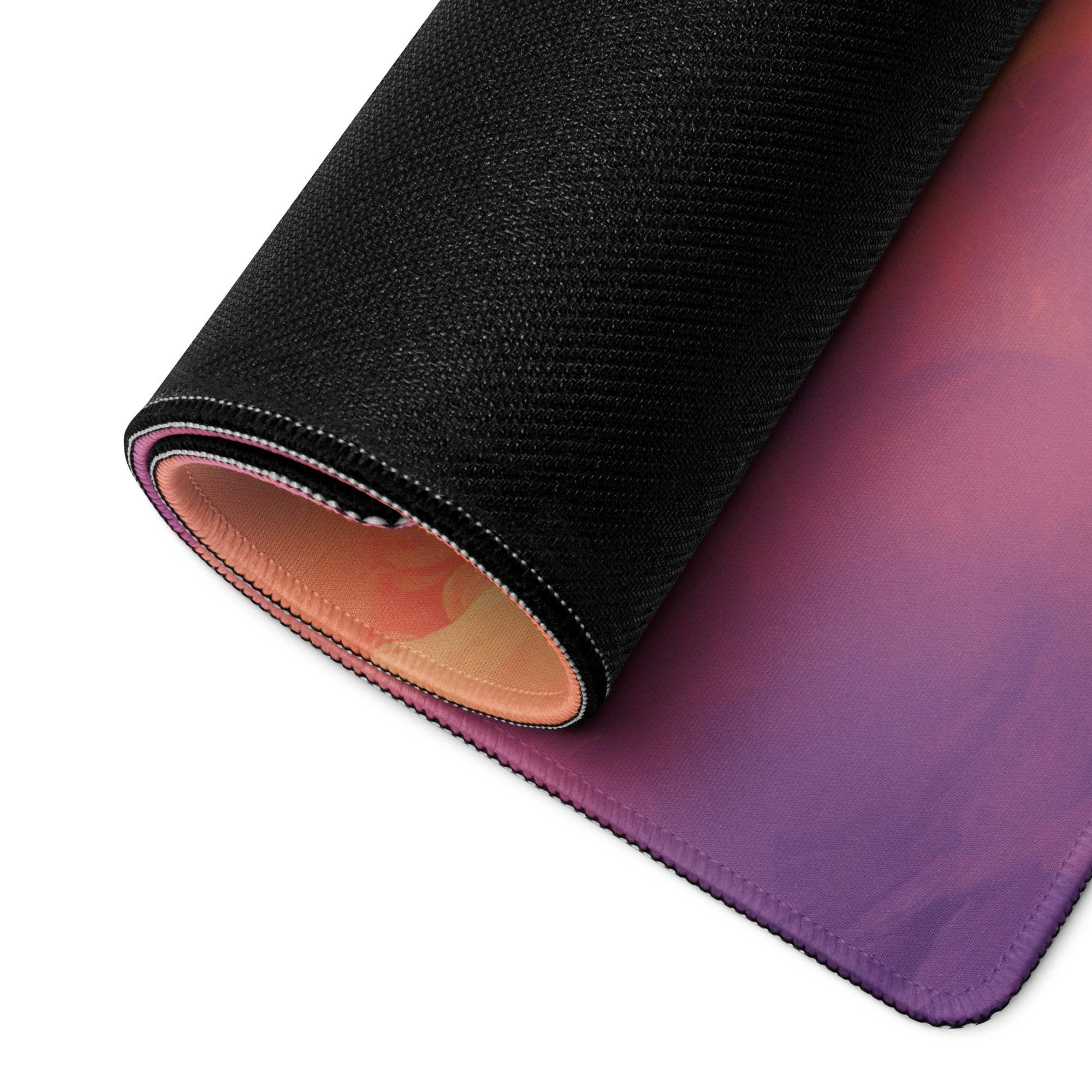 Rolled-up Dreamy Sunrise Cloudscape gaming mouse pad with purple-to-pink gradient