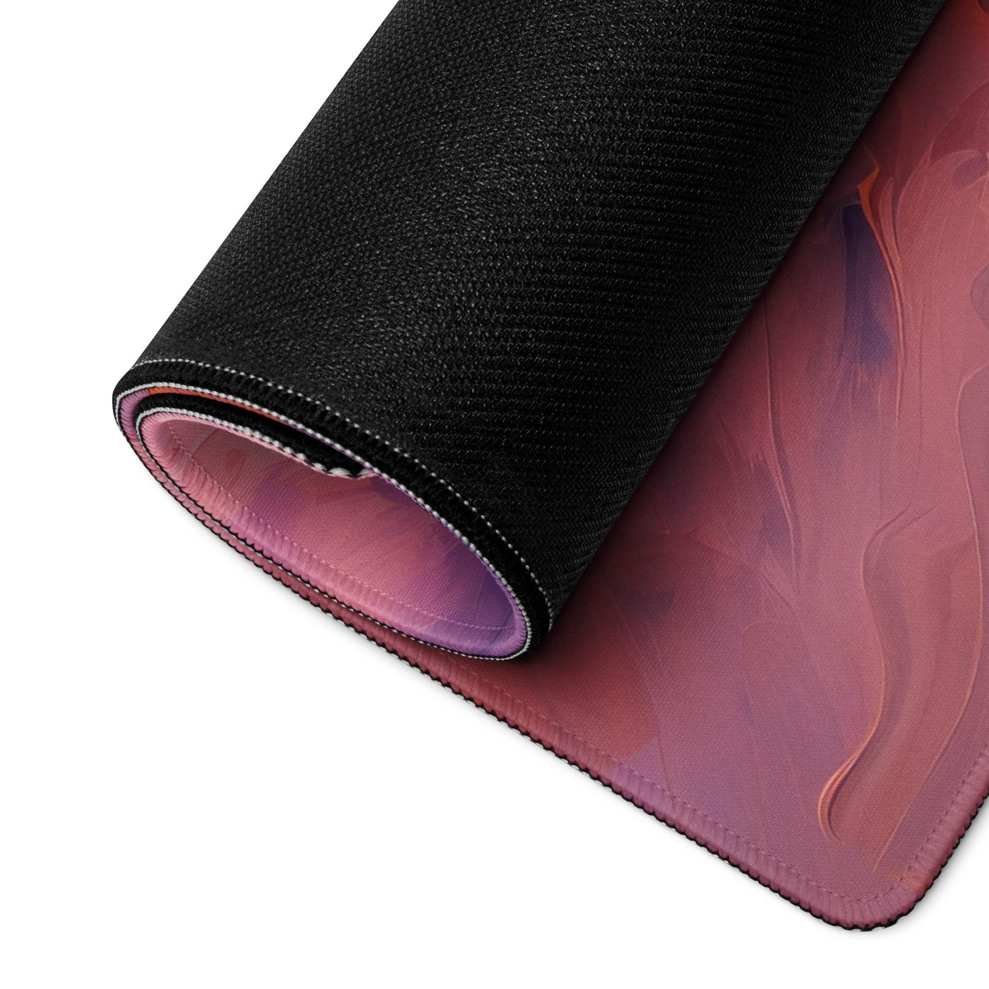 Vibrant abstract sunset gaming mouse pad rolled up with gradient black to pink purple design