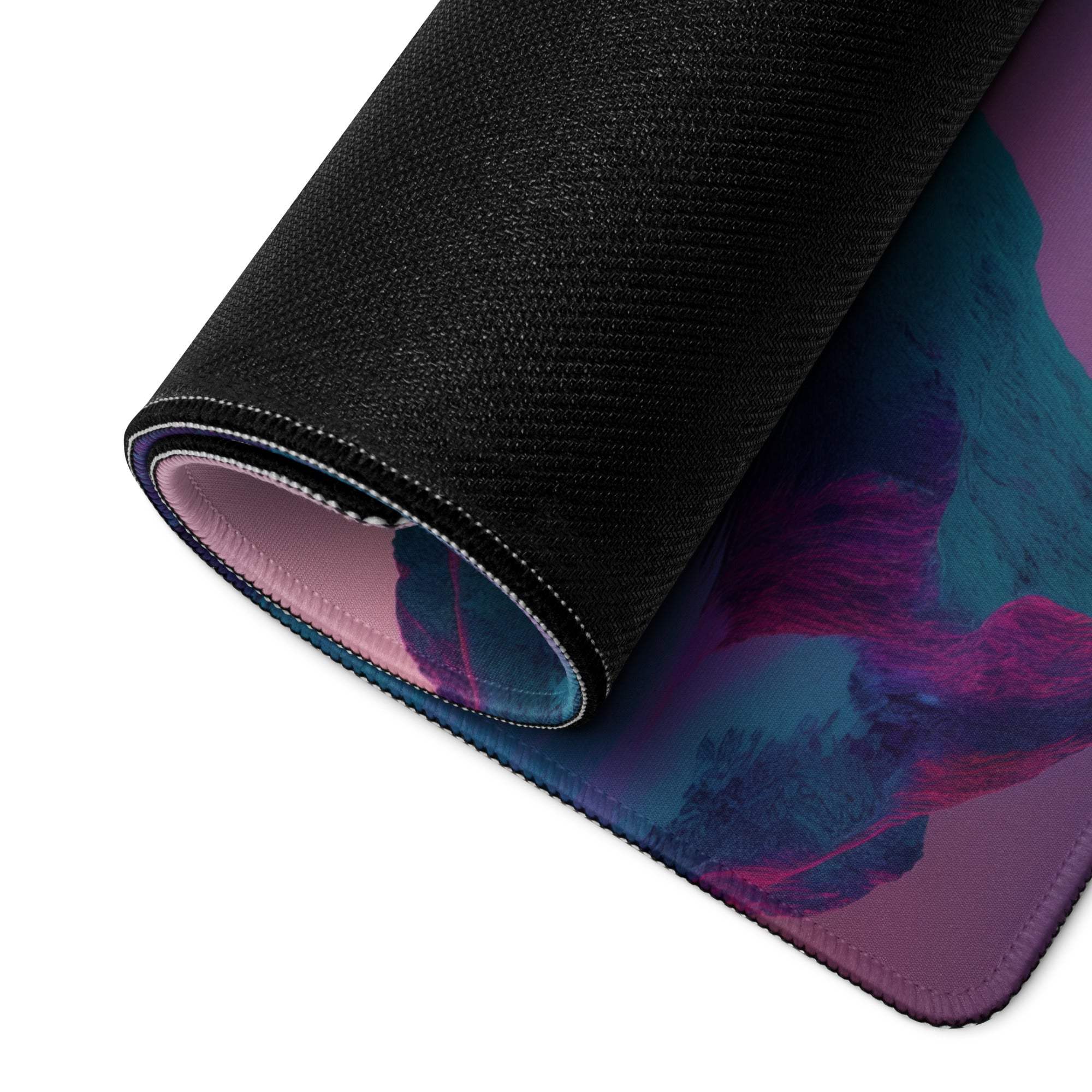 Rolled-up neon pink purple mountain gaming mouse pad with vibrant design