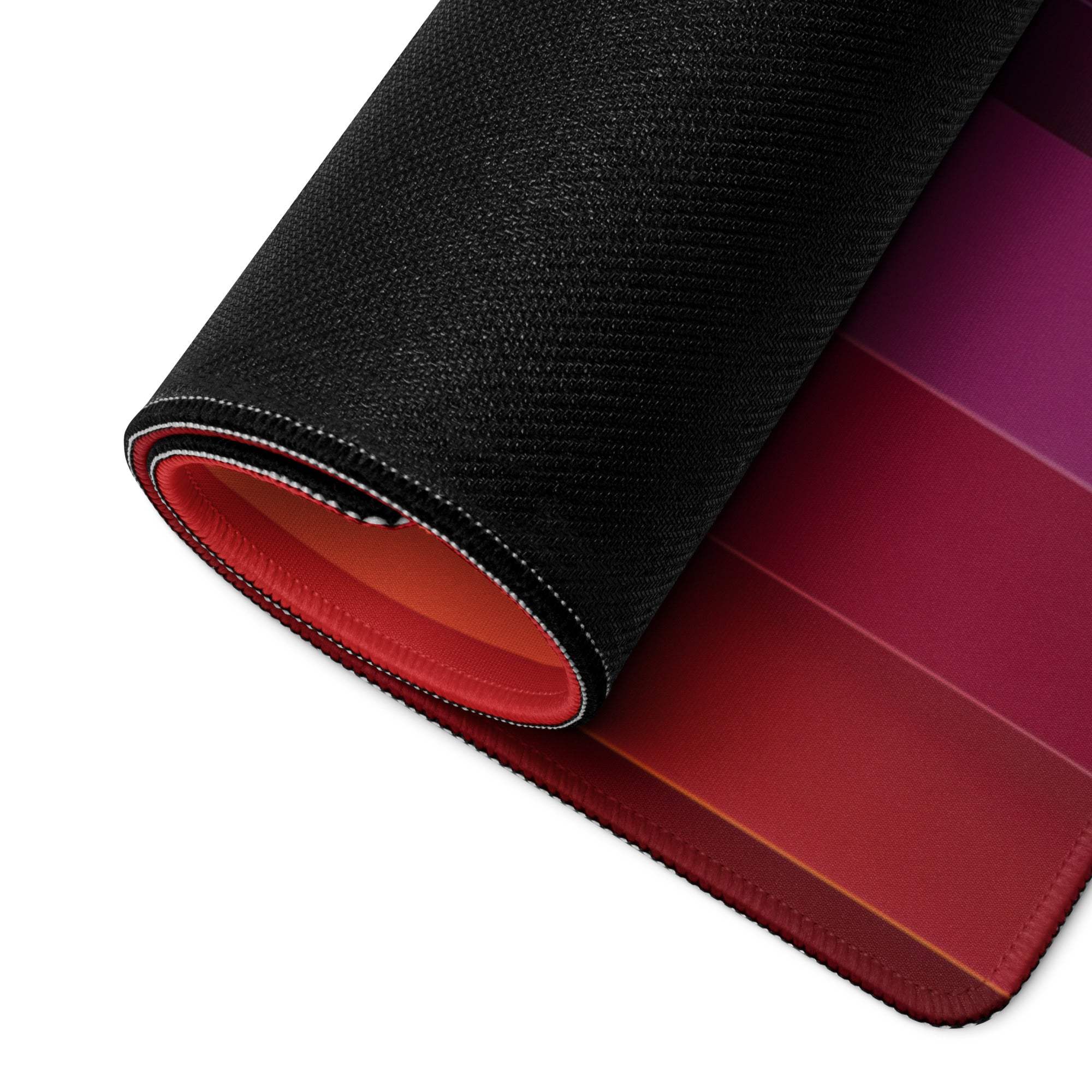 Black and red gradient gaming mousepad with stitched edges and textured surface