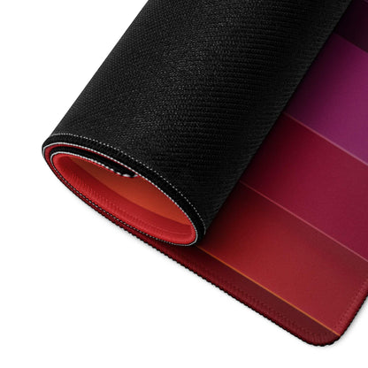 Black and red gradient gaming mousepad with stitched edges and textured surface