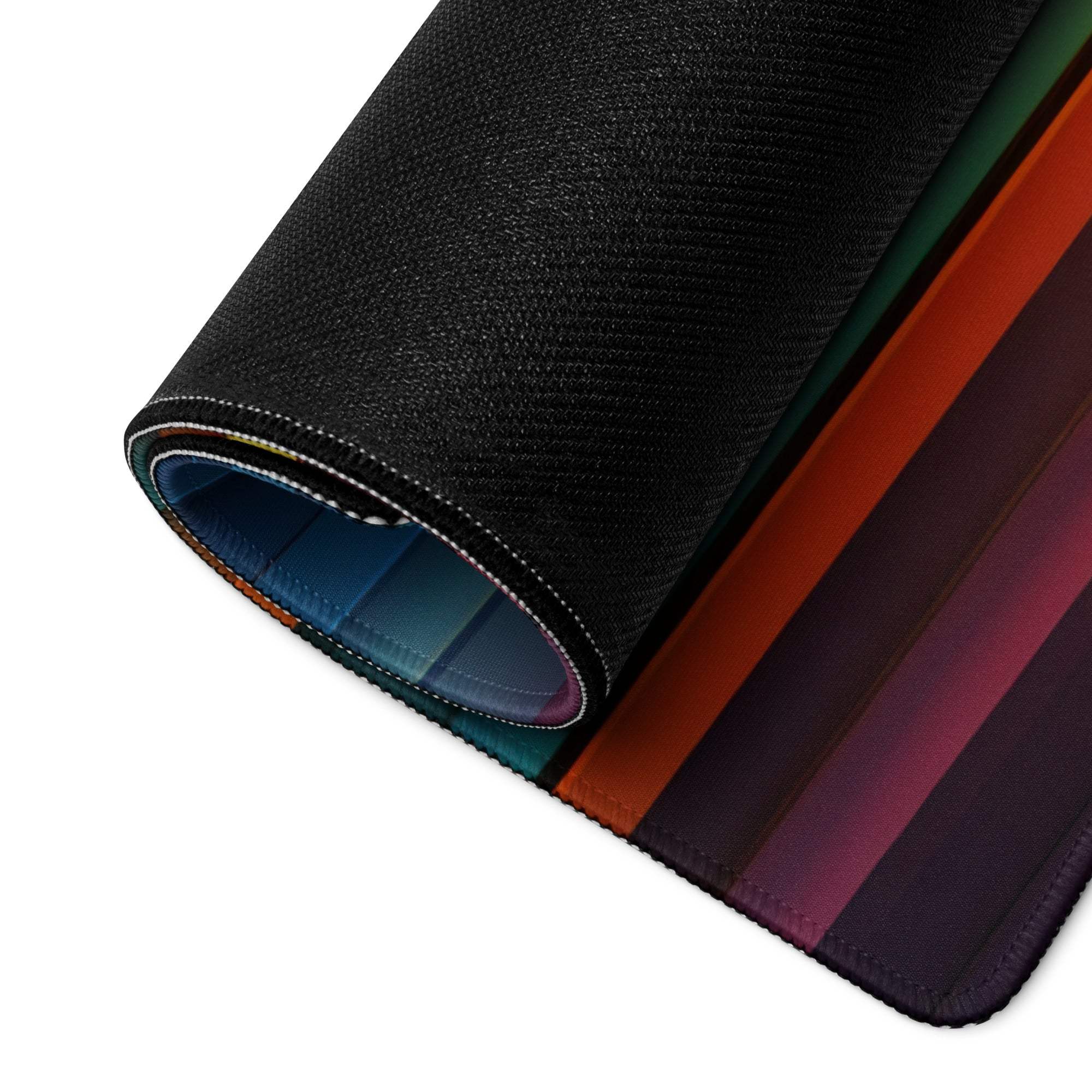 Rolled-up Vibrant Striped Spectrum gaming mouse pad with green, orange, purple gradient