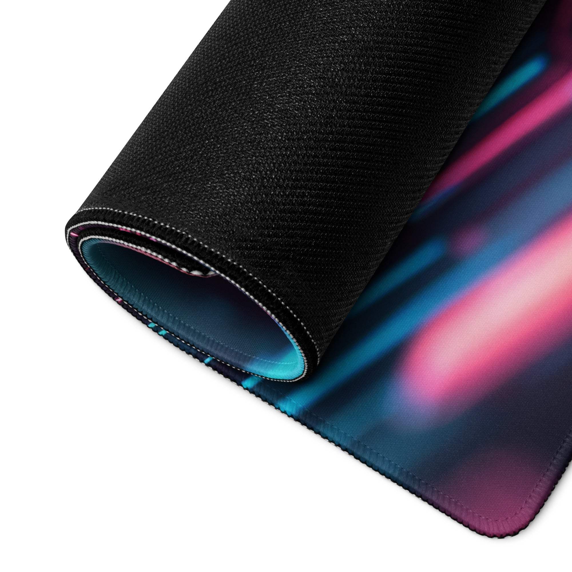 Rolled-up Cyberpunk Neon Cityscape gaming mouse pad with pink-blue gradient