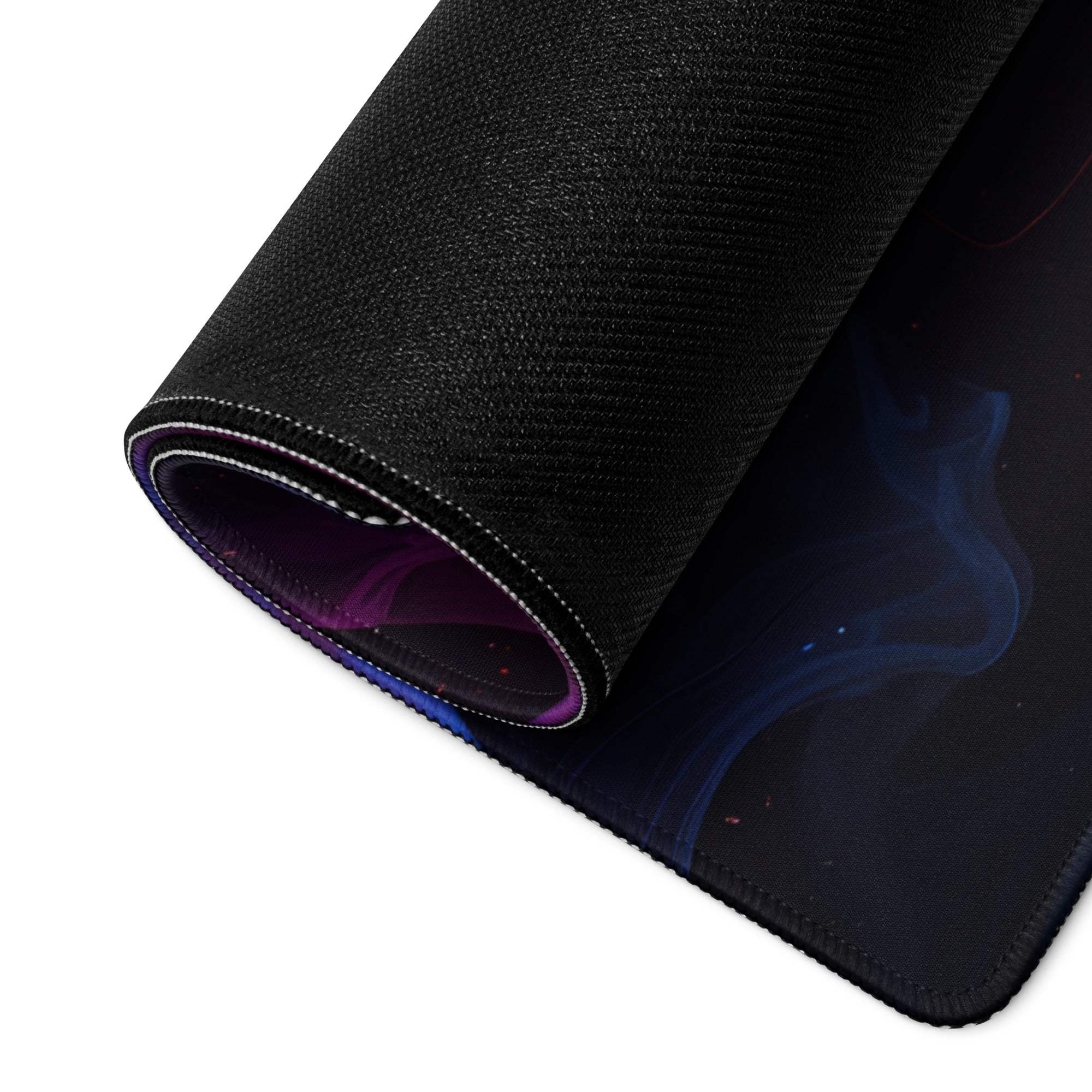 Black cosmic gaming mousepad with purple blue nebulae, rolled textured non-slip back