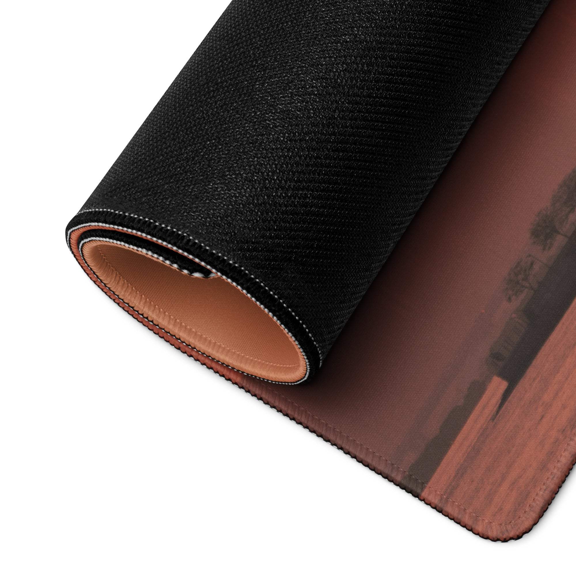 Black textured mousepad with sunset city skyline design and tan leather underside