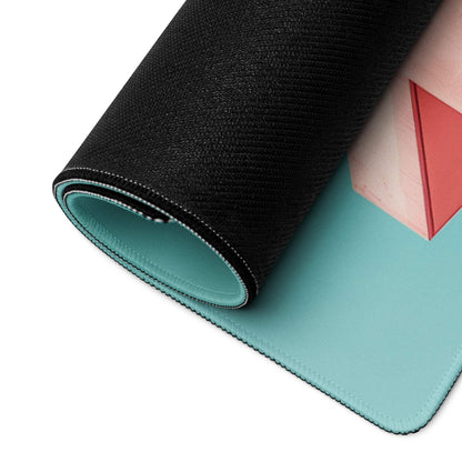Rolled-up teal and pink minimalist gaming mouse pad with geometric red triangles