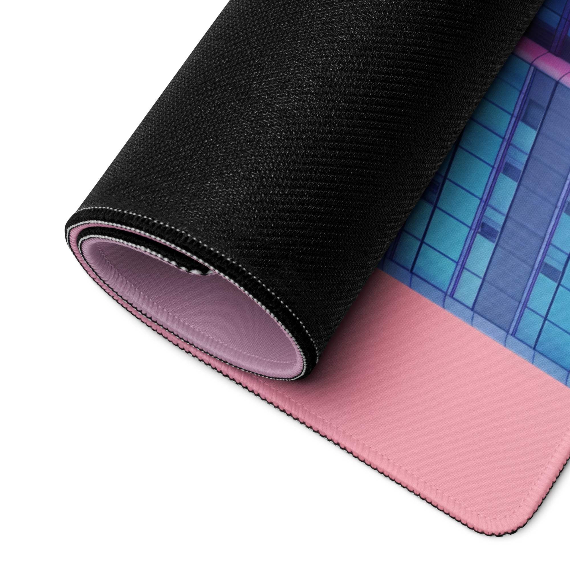 Rolled-up Neon Pink Gradient Cityscape gaming mouse pad with non-slip base
