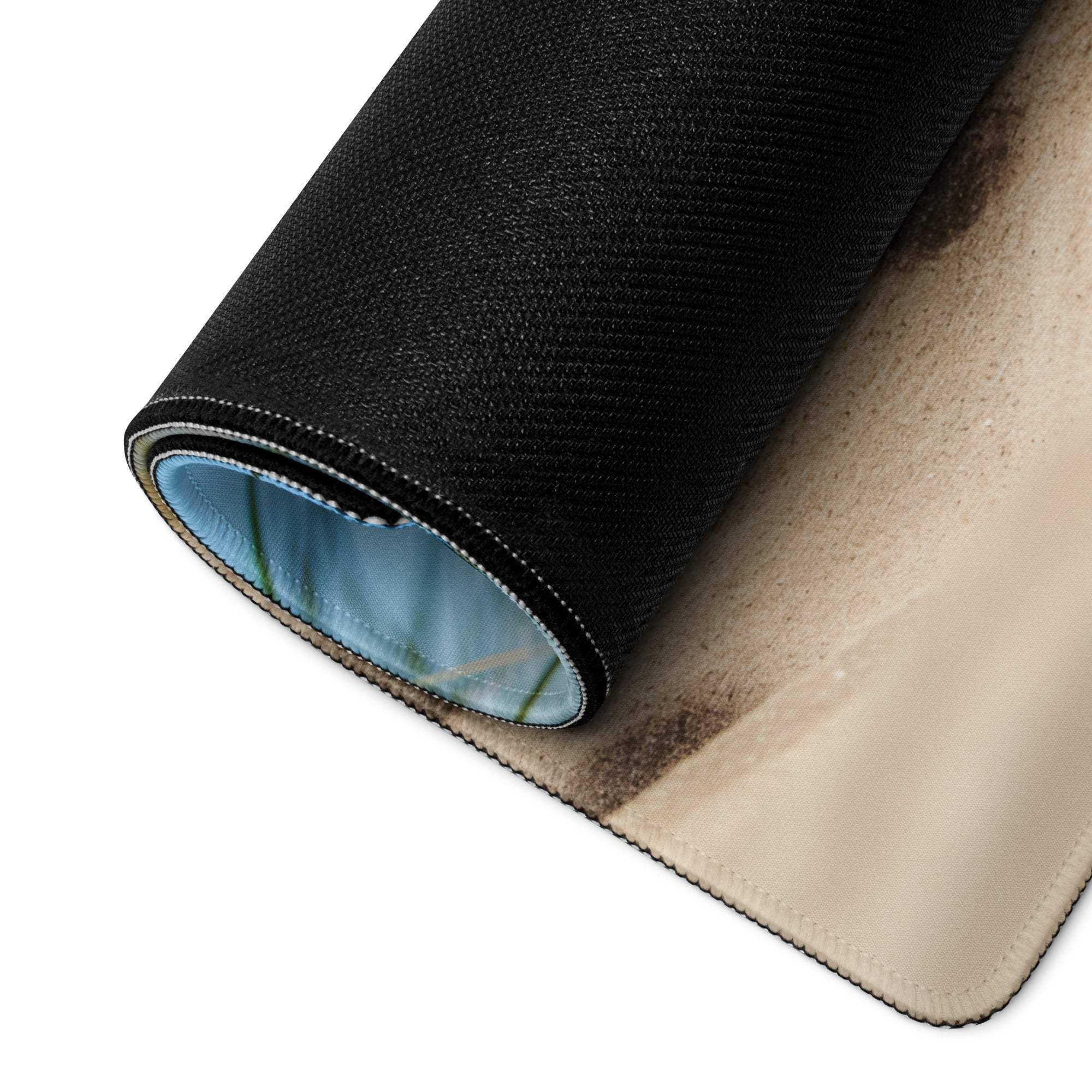Coastal beach scene blue gaming mouse pad backside rolled to reveal texture