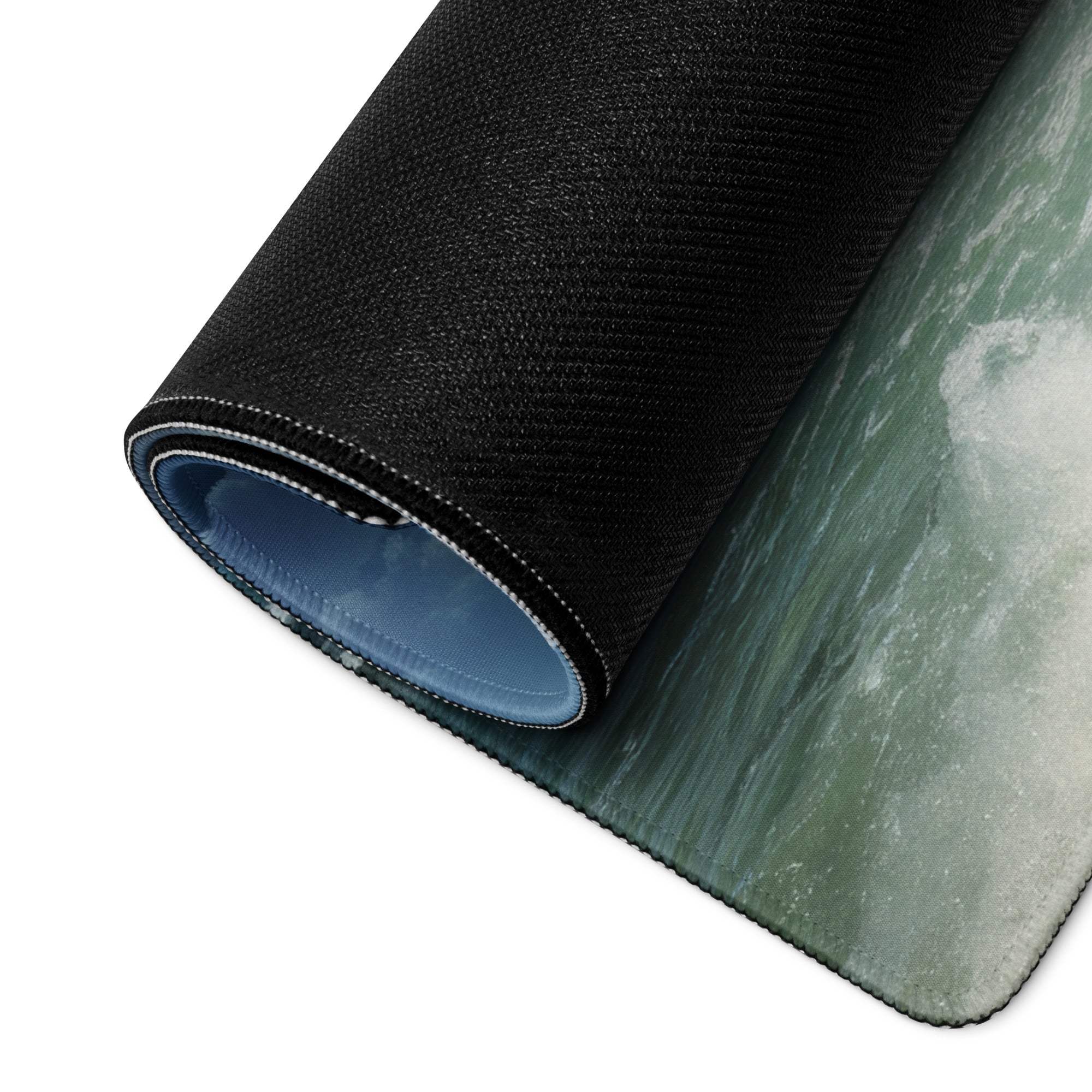 Black textured ocean wave mousepad with blue lining and non-slip backing