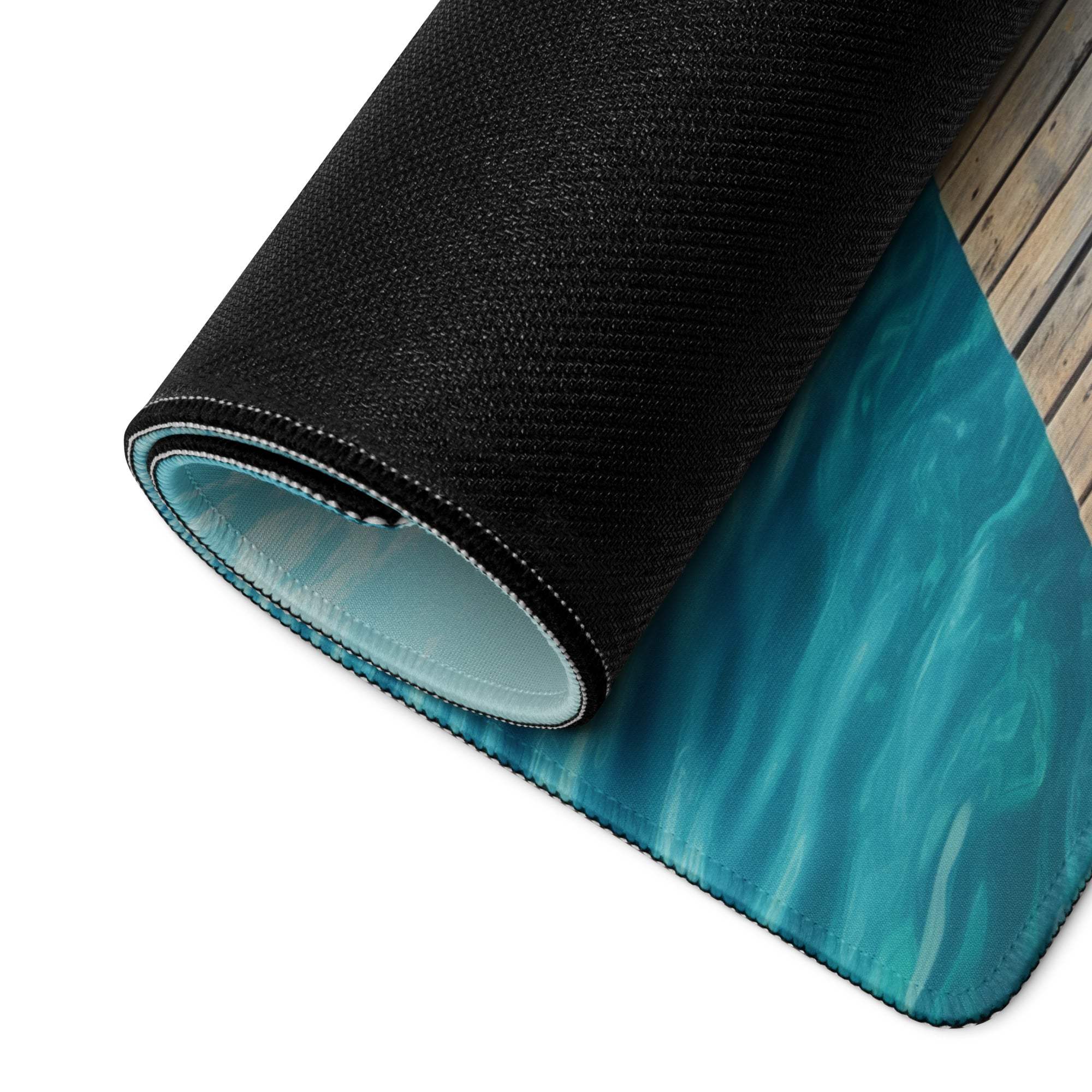 Black and teal calm ocean dock gaming mouse pad with textured surface