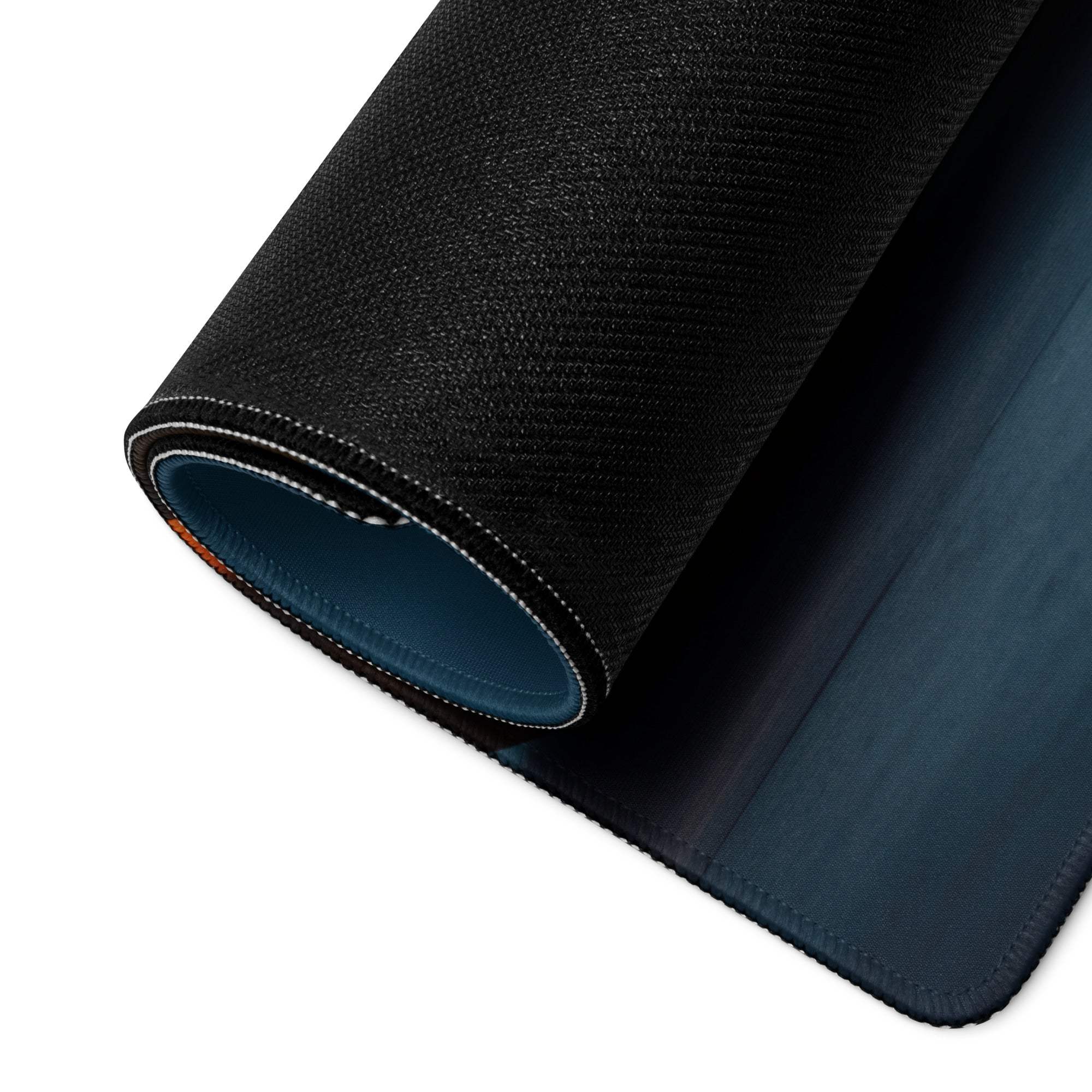 Back of Halloween pumpkin carving gaming mouse pad, black textured top, navy underside