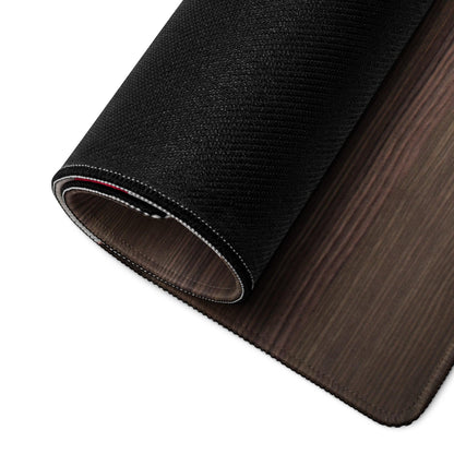 Back of large wood grain brown gaming mouse pad with black textured non-slip base and stitched edges