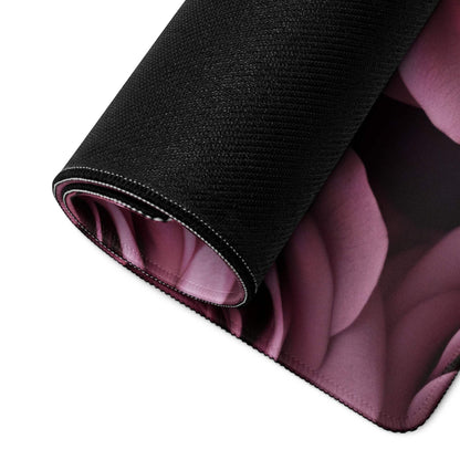 Black gaming mousepad rolled edge reveals purple floral inside