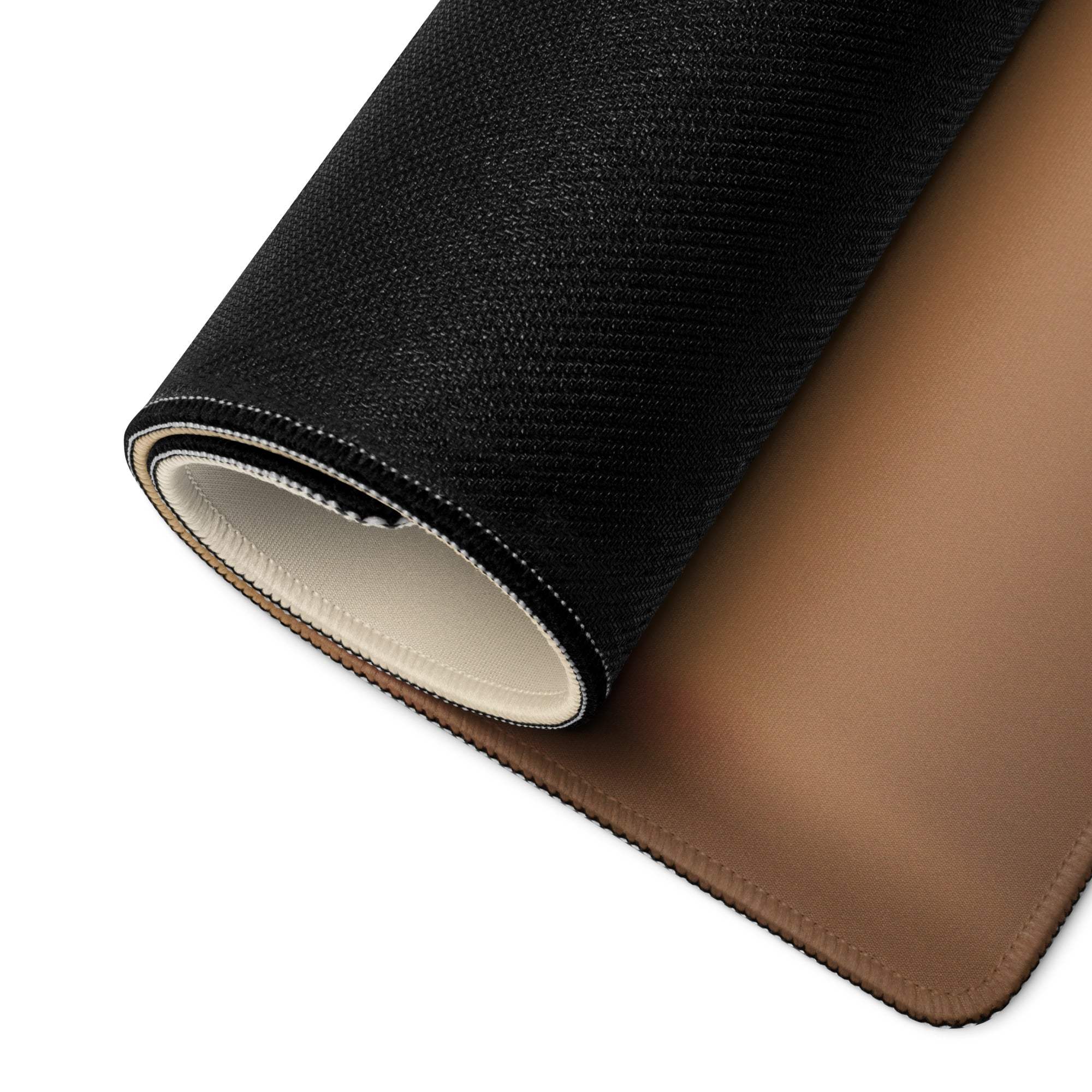 Back of Sunset Style Golden Wheat gaming mouse pad with black textured fabric, tan underside and white stitching