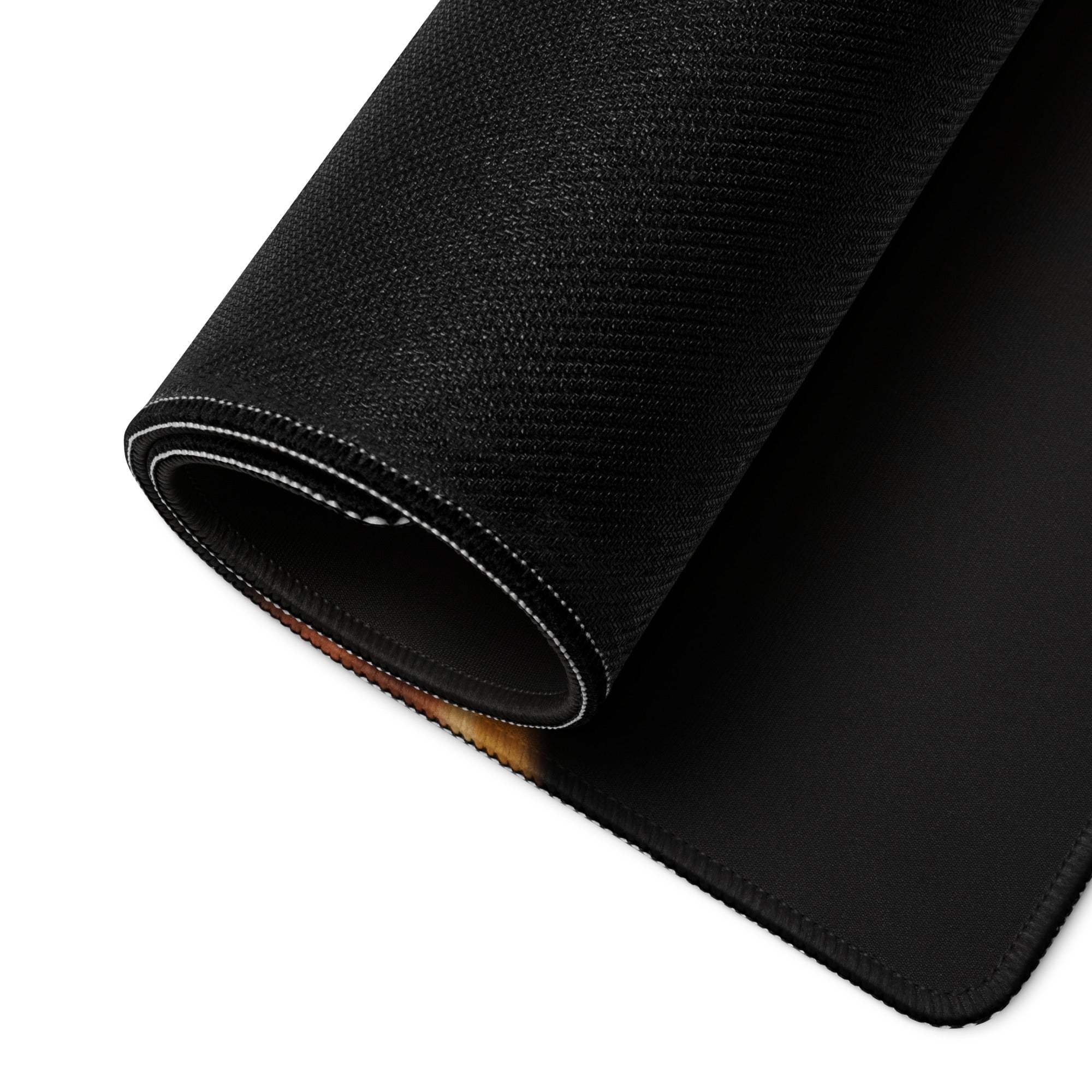 Black textured gaming mousepad with white edge stitching and non-slip rolled edge