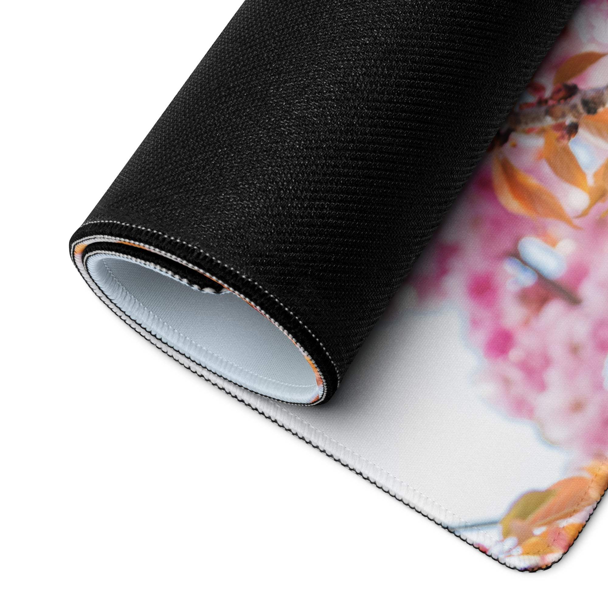 Rolled-up Floral Pink Blossom extra large gaming mouse pad with vibrant floral design