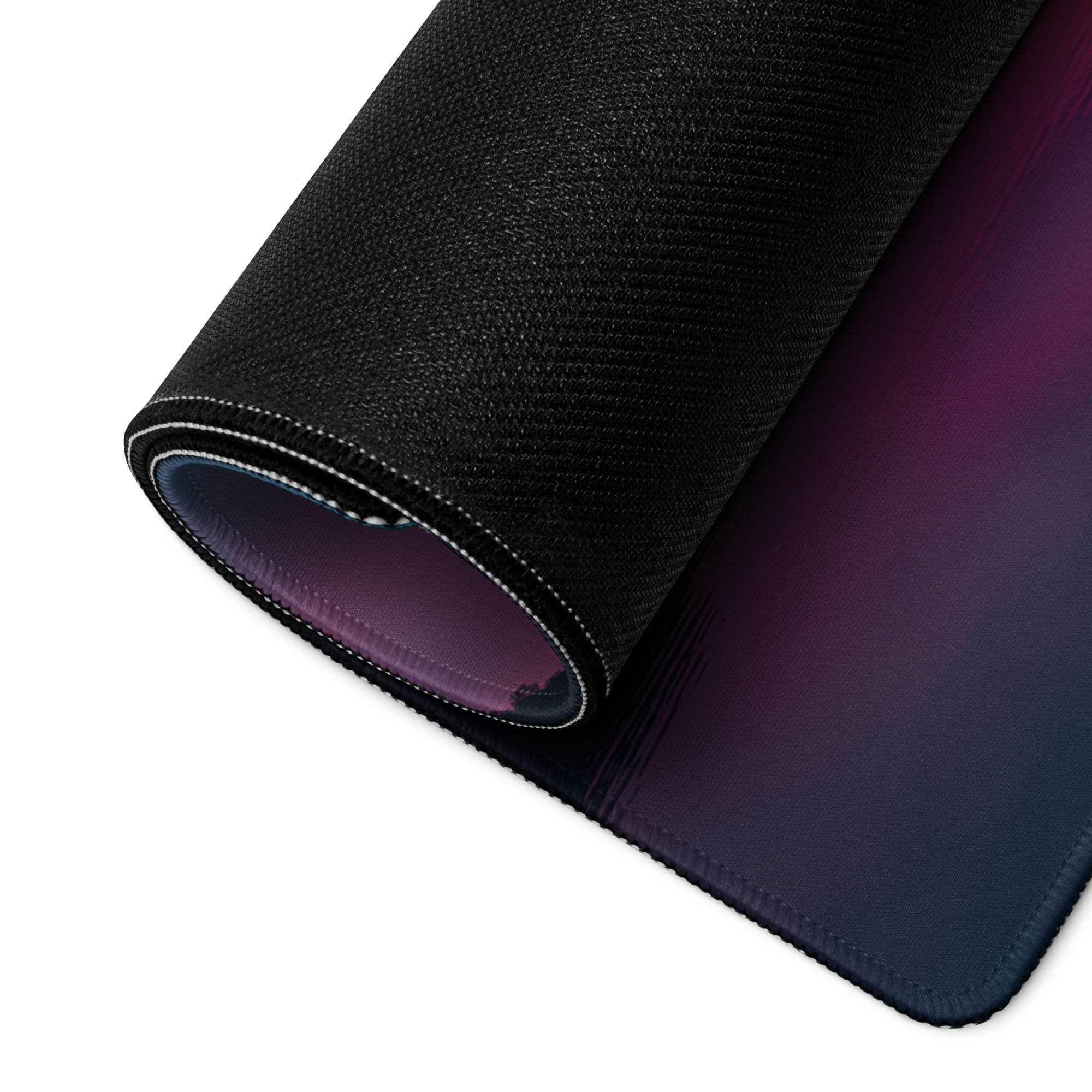 Black textured mousepad with purple-blue gradient, white stitched edge, non-slip base
