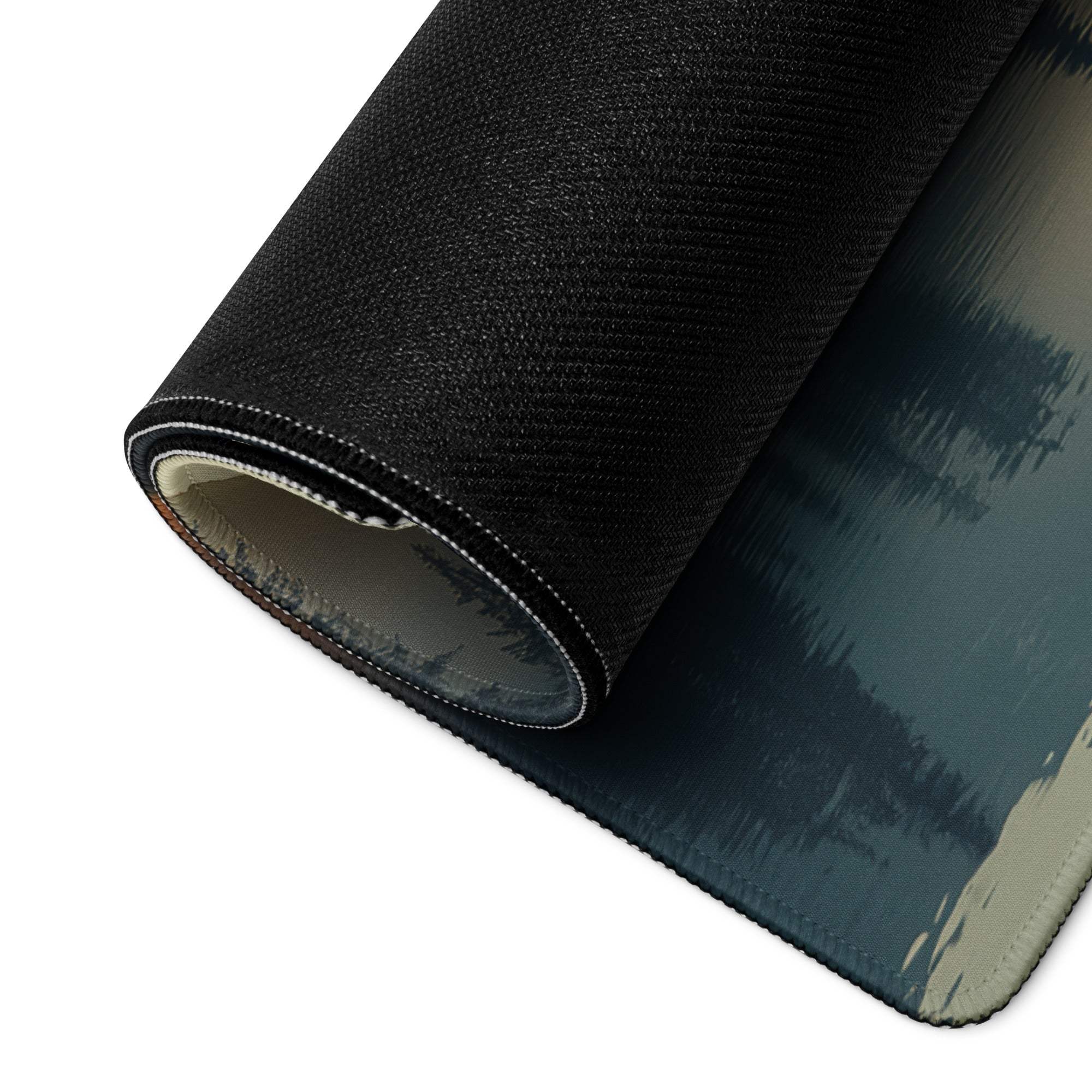 Black textured gaming mousepad with teal-gray abstract design and stitched edge