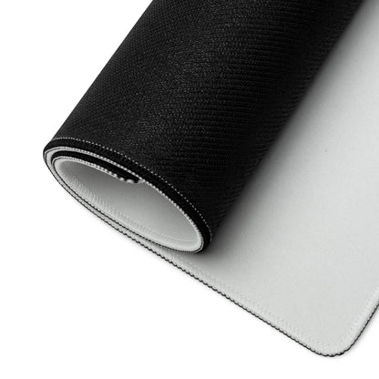 Black and white gaming mousepad with stitched edges and textured surface