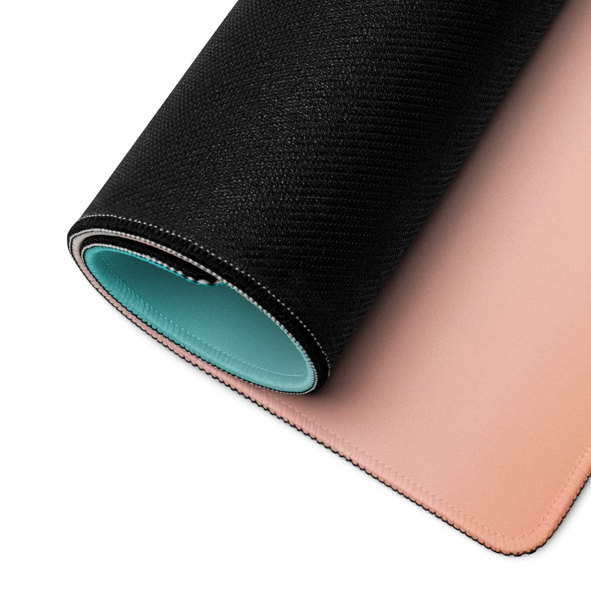 Rolled-up Pastel Sunset Palm Tree gaming mouse pad with stitched edges