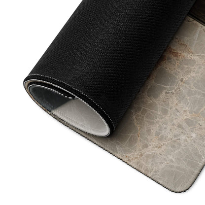 Back of black textured gaming mouse pad with gray marble underside