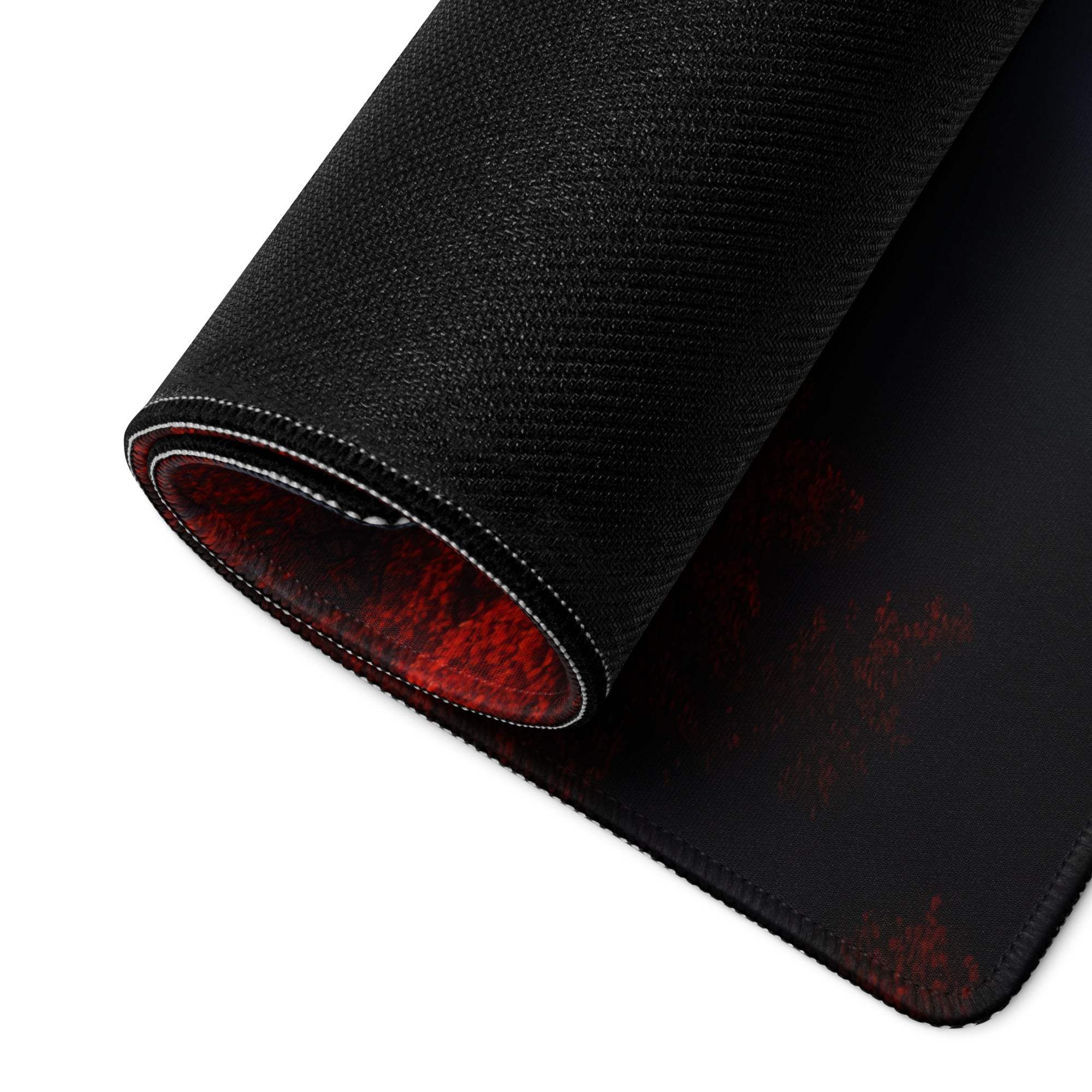 Back of Landscape Style Forest Moody Red gaming mouse pad with black texture, red underside, white stitching