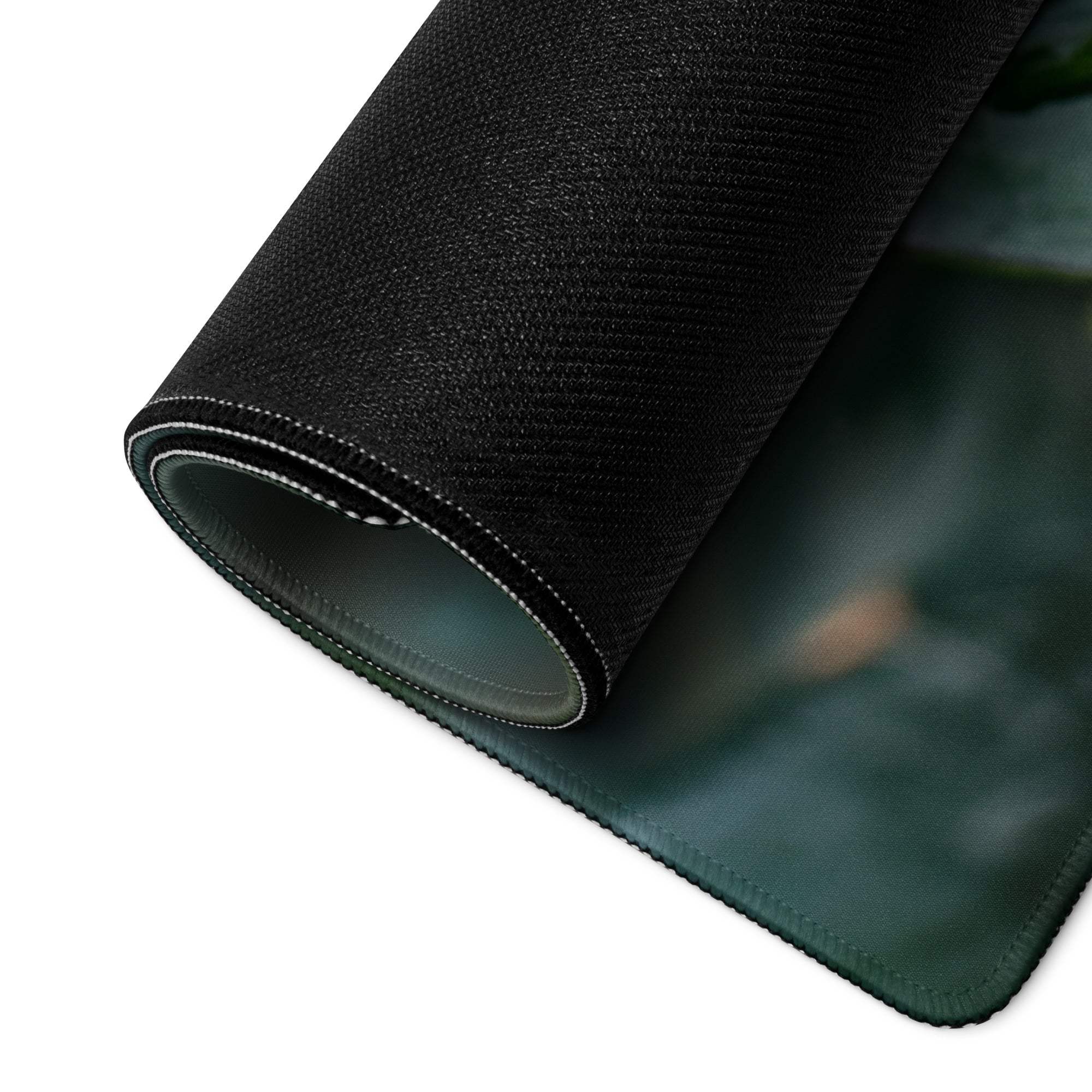 Black textured gaming mousepad with green edge, white stitched trim, non-slip backing