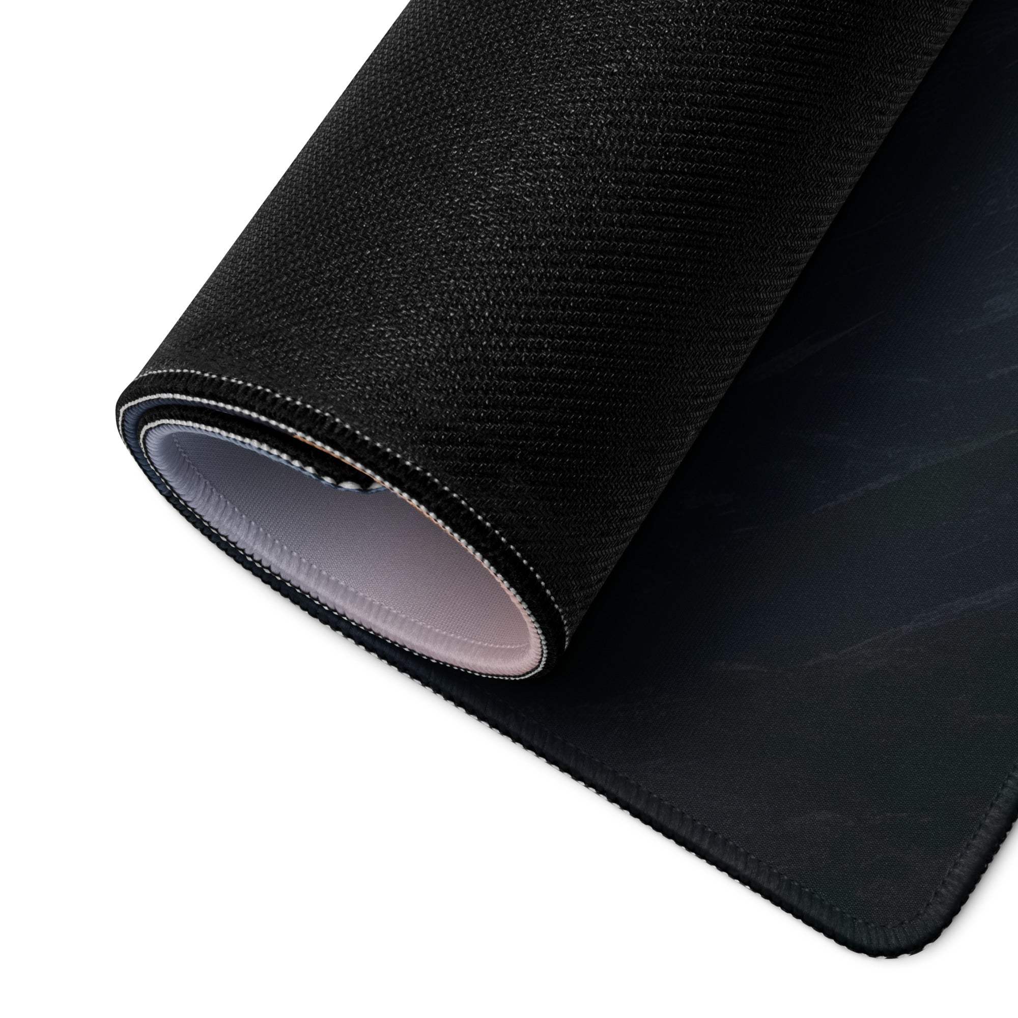 Black textured back of minimalist mountain sunset gaming mouse pad with gray underside and stitched edges