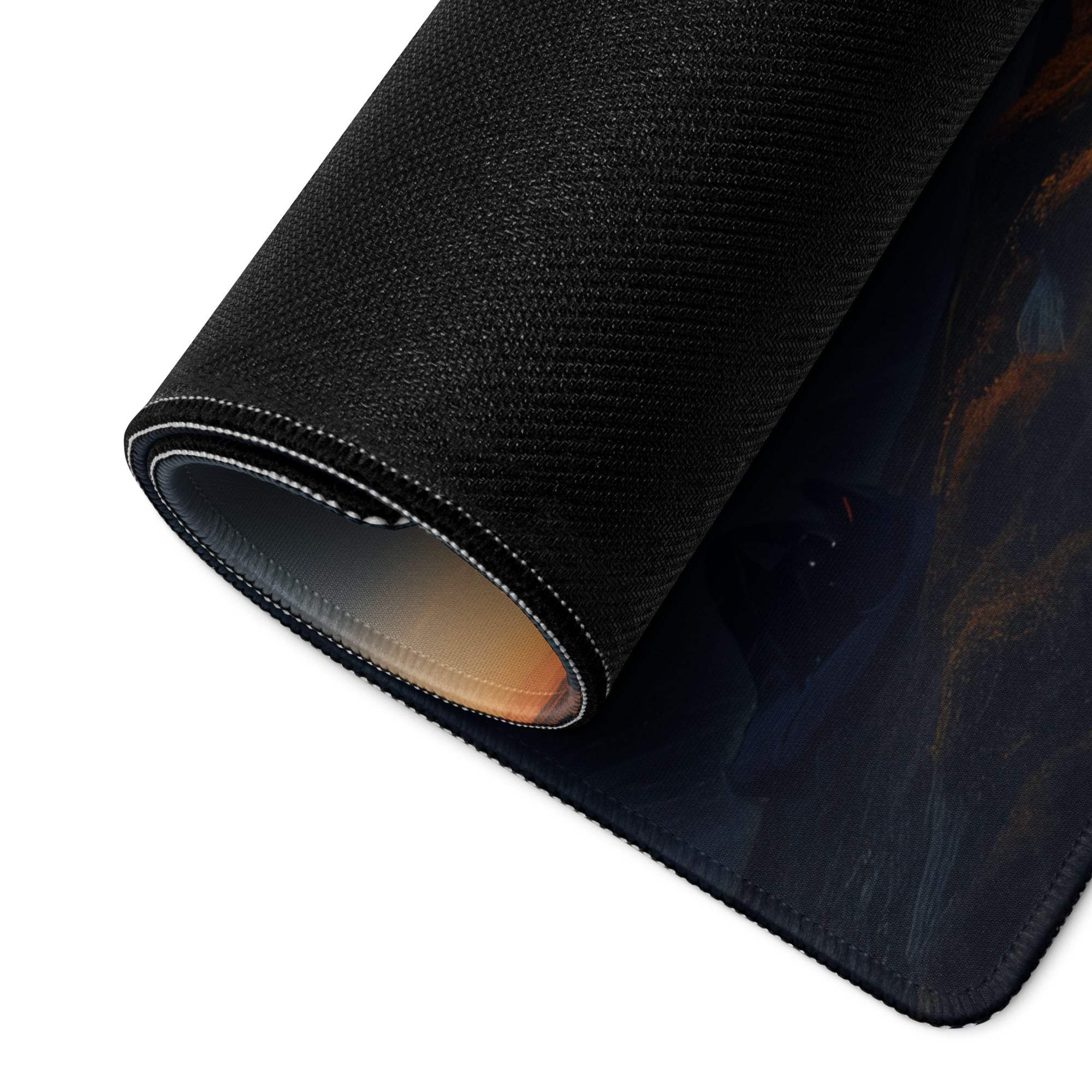 Black textured Epic Mountain Sunrise mousepad rolled to show stitched edge