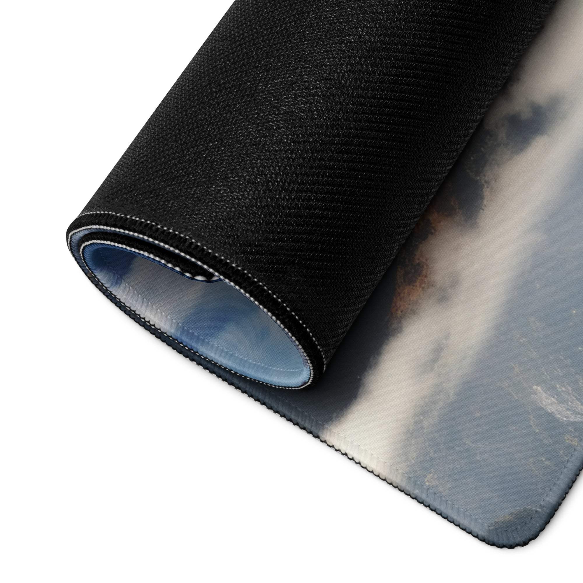 Black textured mousepad with gray white cloud design and non-slip base